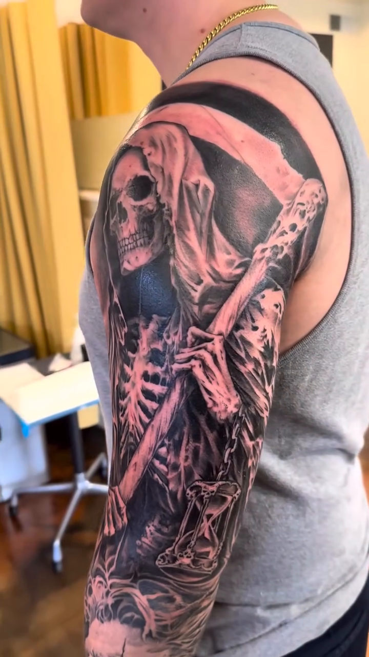 Grim Reaper and skull sleeve dark realism tattoo by Mason Williams