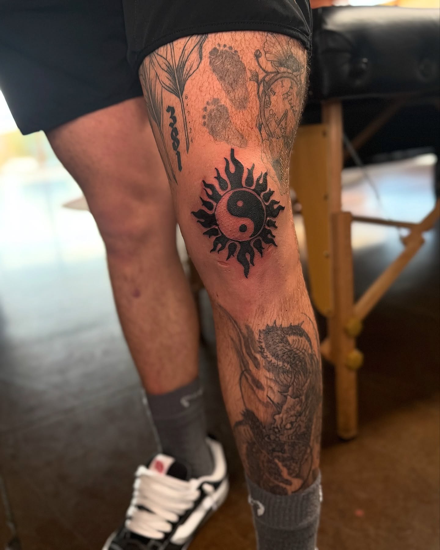 Yin-yang symbol black and grey tattoo on the calf by Jewels, St. George, Utah