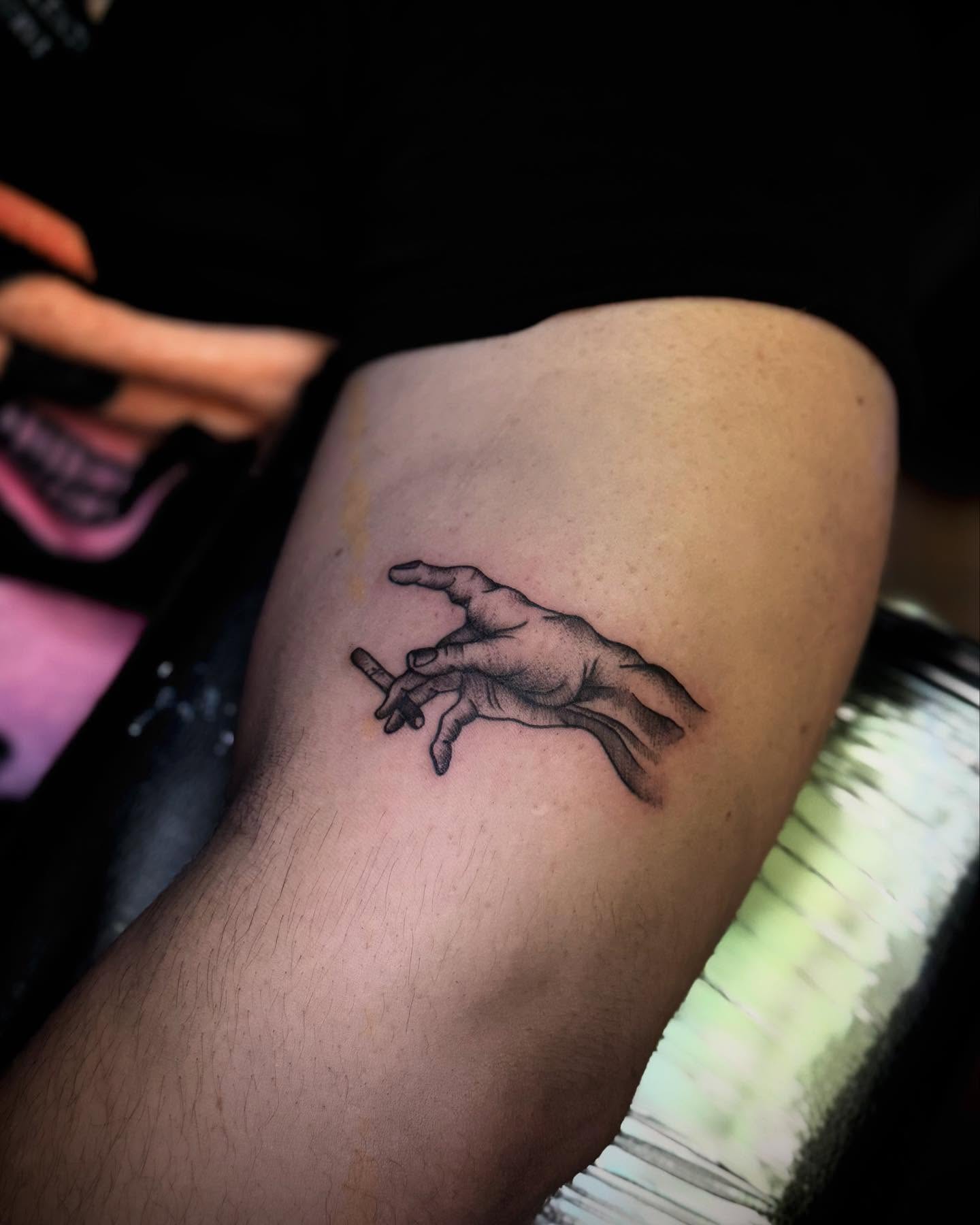 Hand reaching black and grey tattoo on the forearm by Tattoo Artist based in Dallas Tx