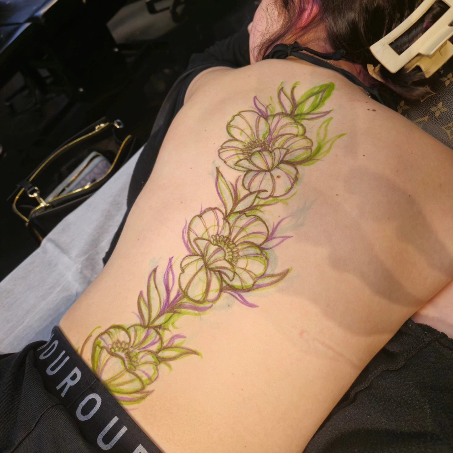 Flower new school tattoo on the back by Barrett Handel