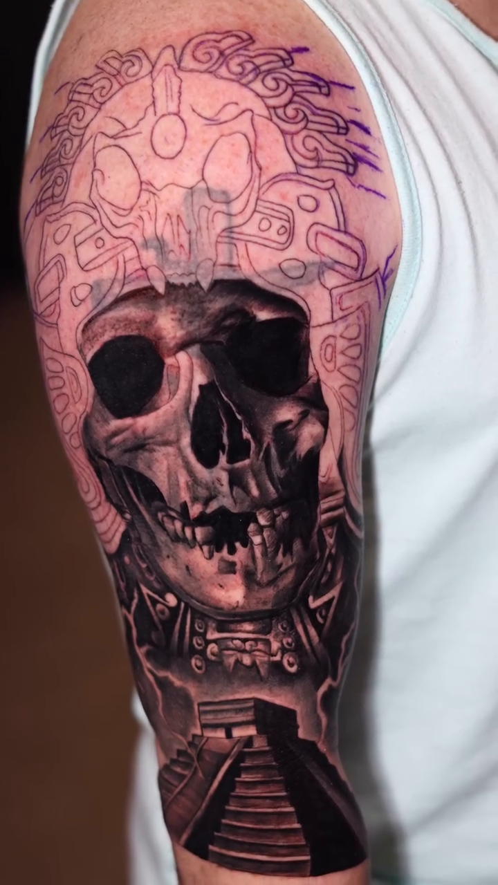 Skull and pyramid realism tattoo by Luis Arenas