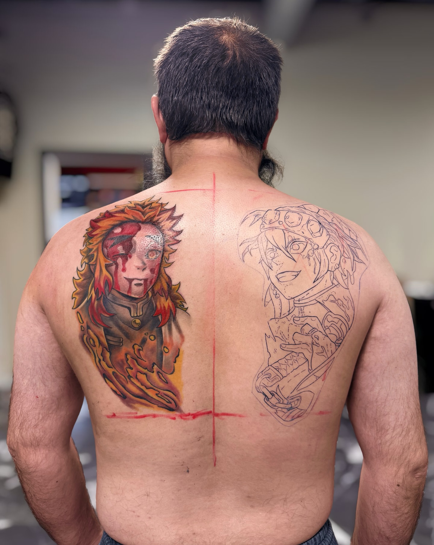 Anime characters anime tattoo on the back by Suda