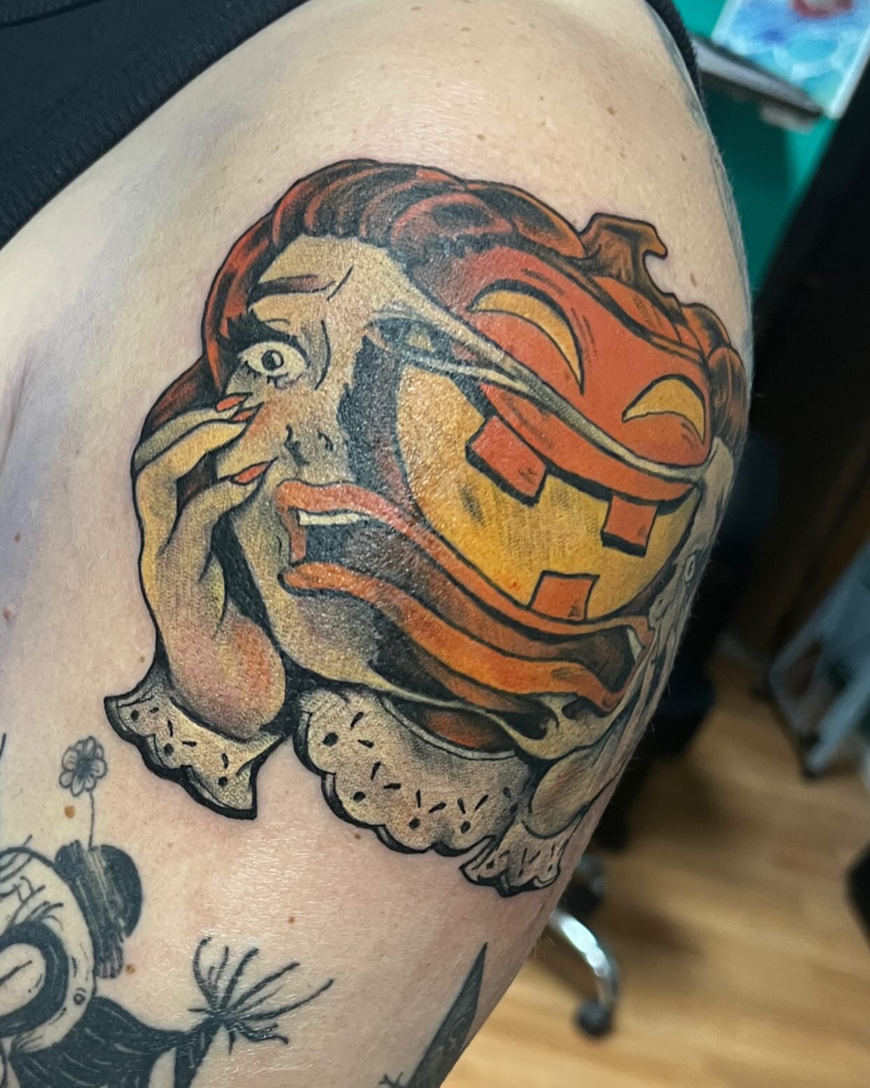 Lion and woman American traditional tattoo on the shoulder by Katie Sayre
