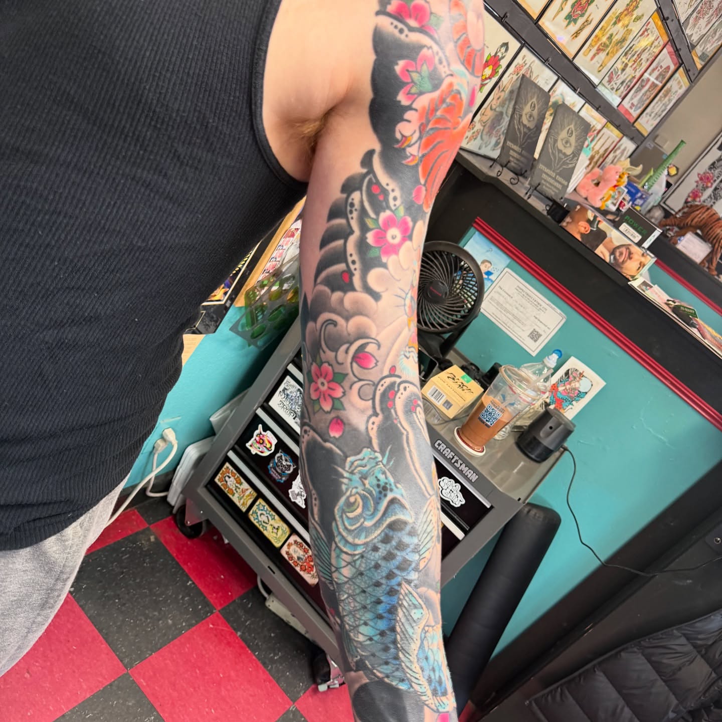 Koi fish and floral japanese irezumi tattoo on the forearm by DemianThompson