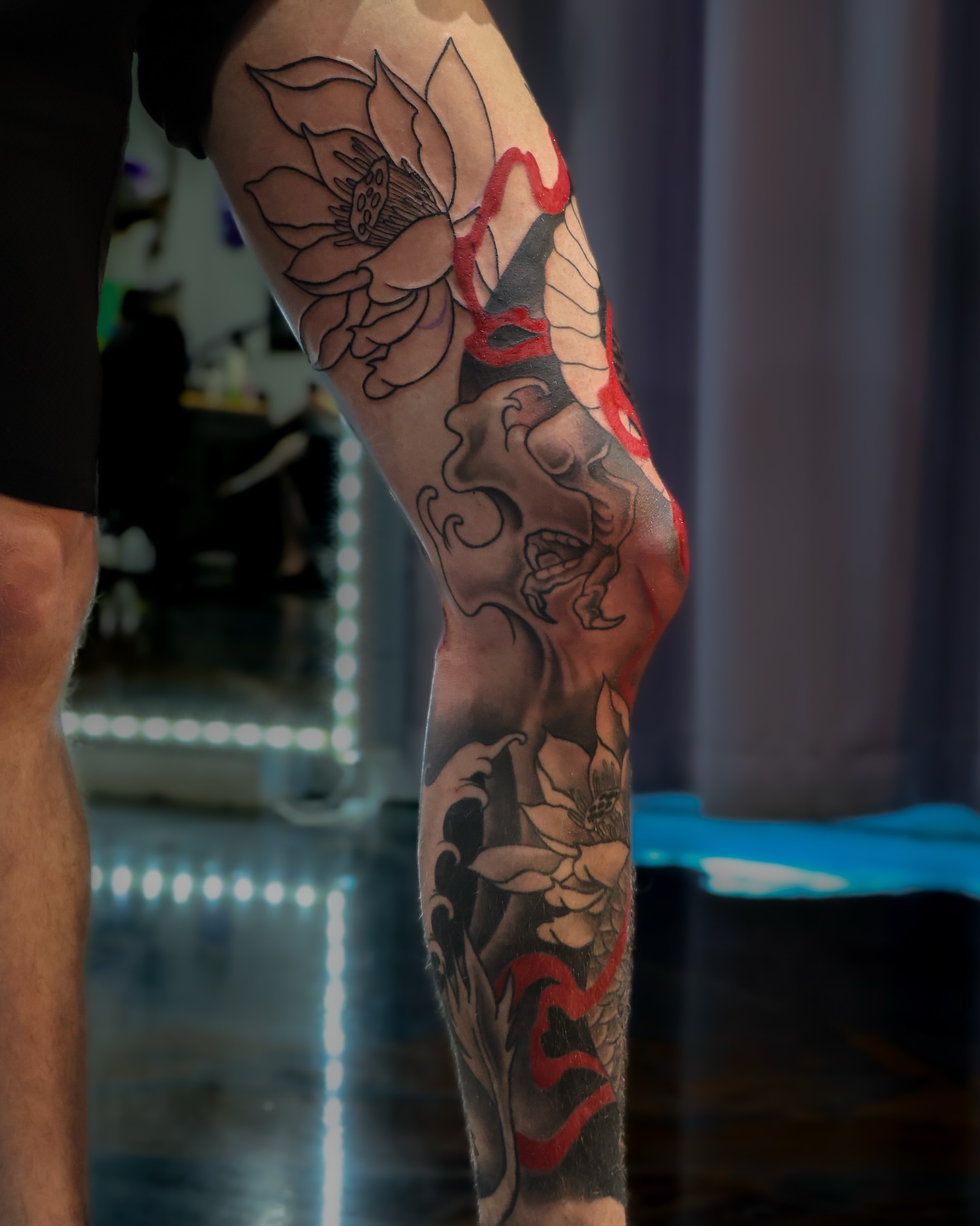 Lotus and dragon japanese irezumi tattoo on the forearm by Tivis Phillips