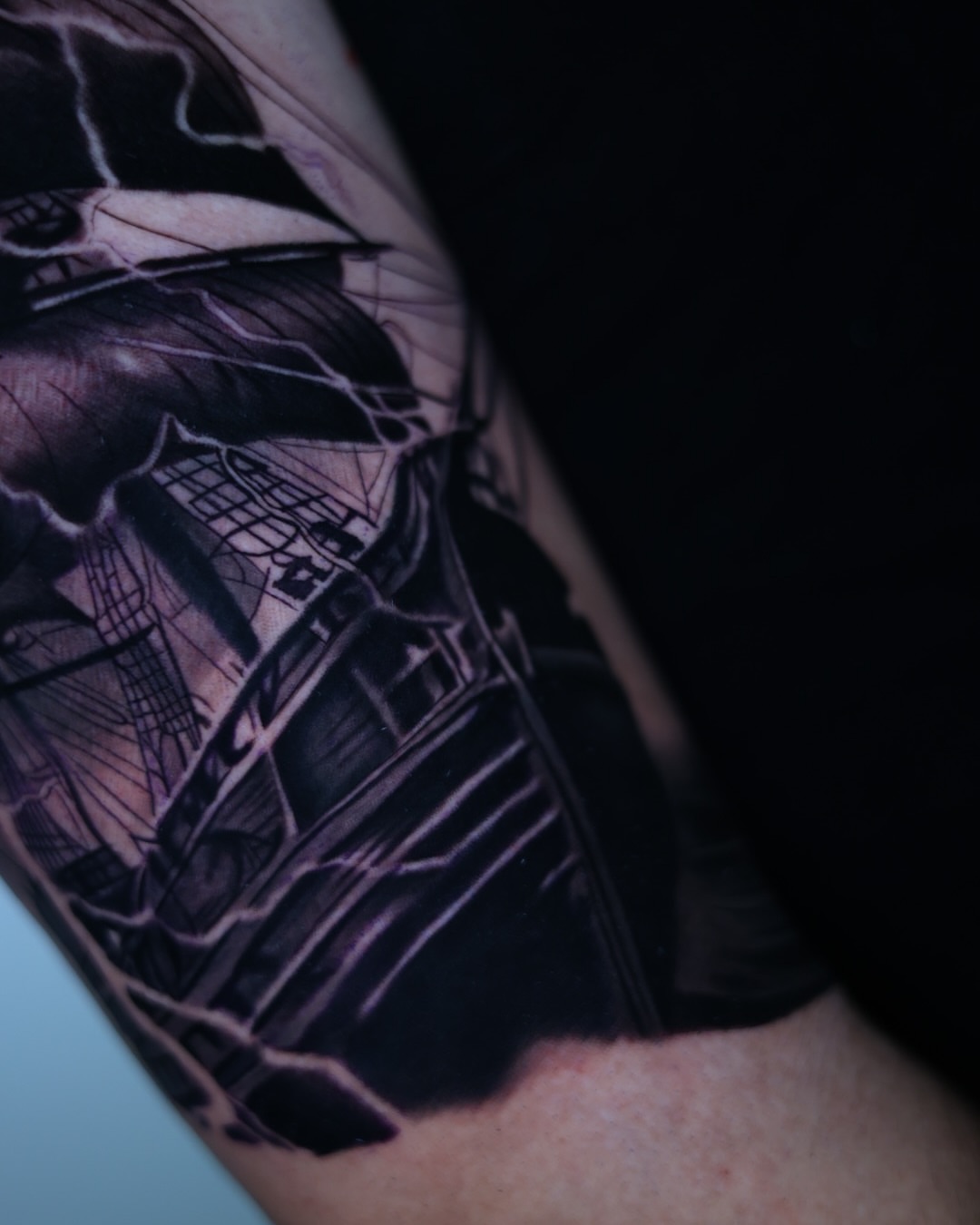 Cityscape realism tattoo on the forearm by Tiago Ink