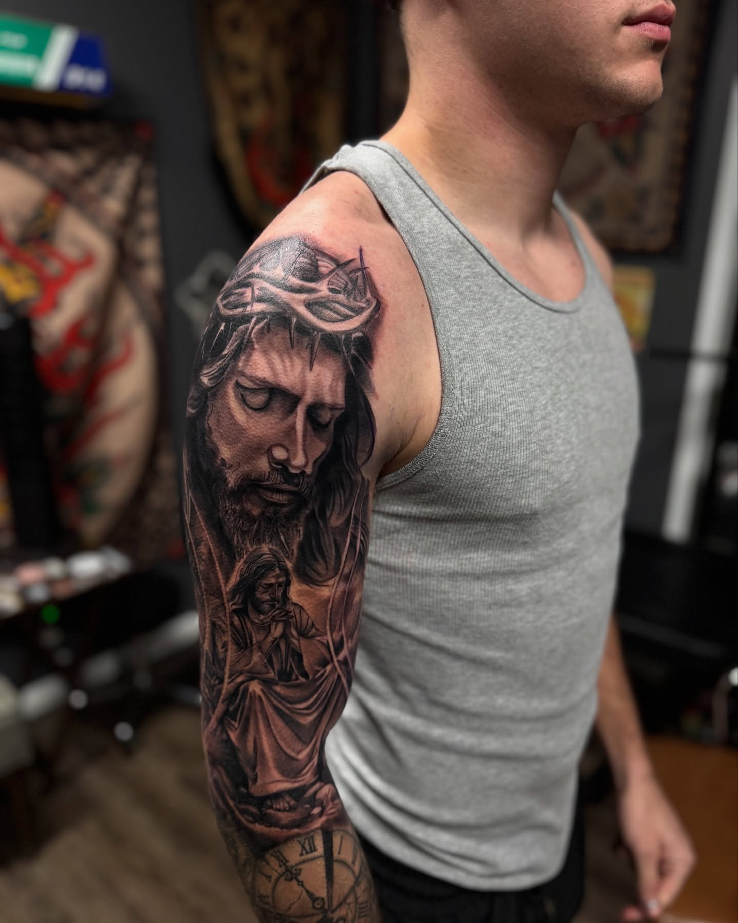 Religious figure realism tattoo on the upper arm by Chris_Tatt2_D’Ascenzo