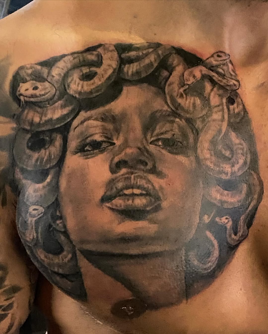Tattoo by @moving_muralsart — realism, black_and_grey