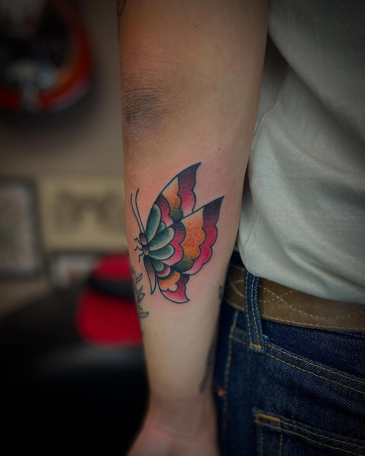 Butterfly new school tattoo on the forearm by JD Bassett