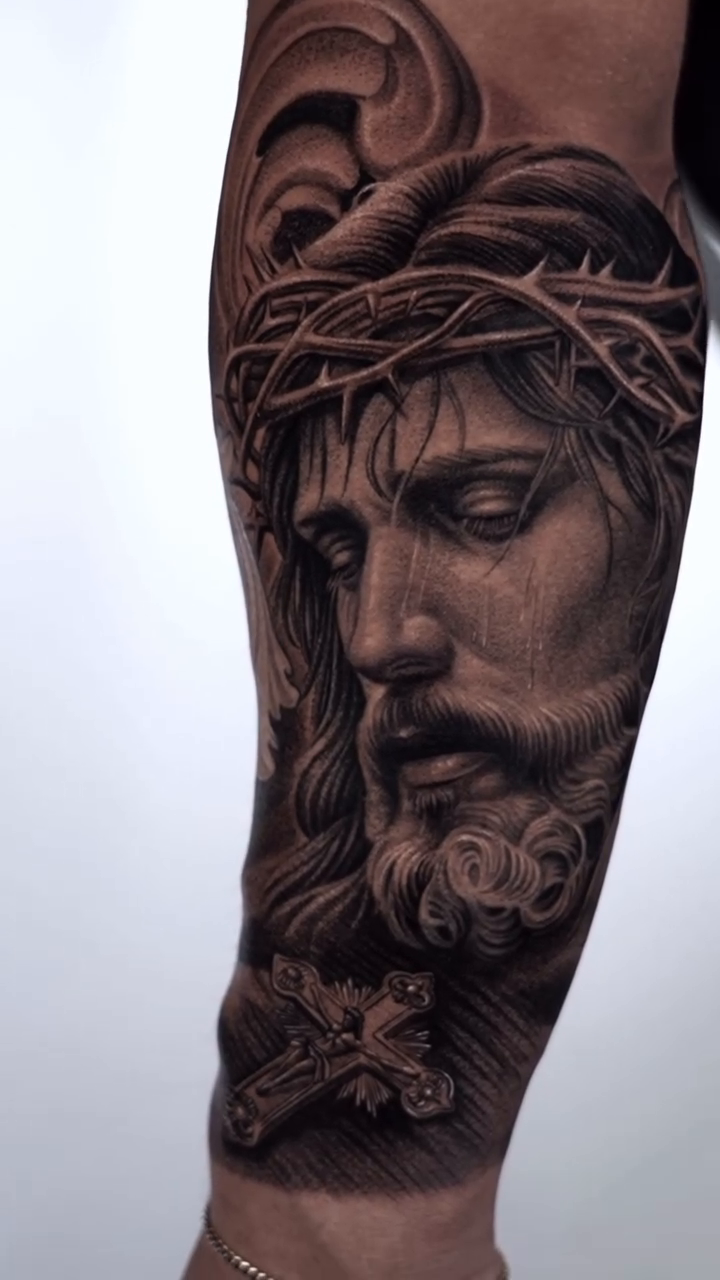 Jesus Christ portrait Chicano tattoo on the forearm by Enrique Martinez
