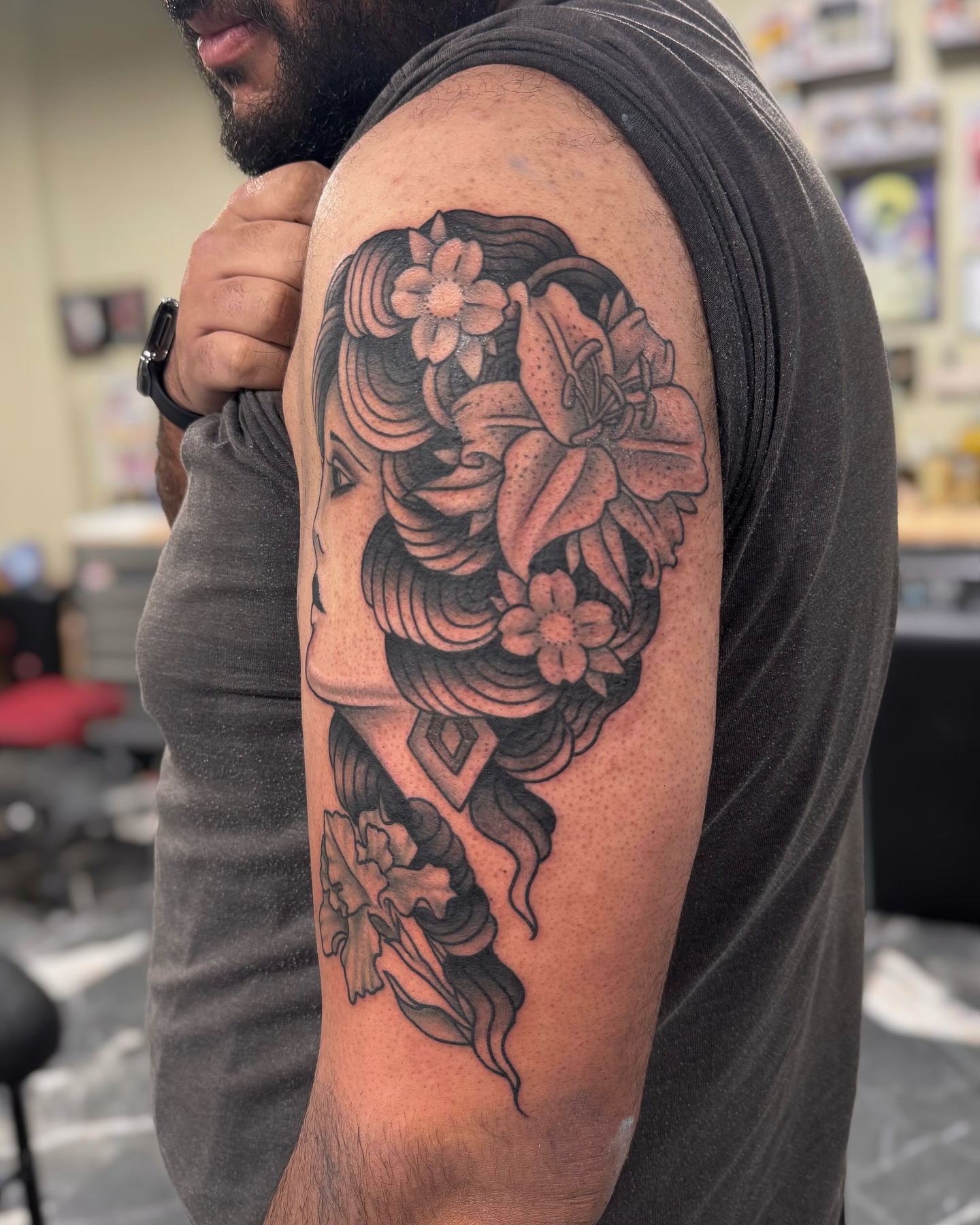 Floral portrait japanese irezumi tattoo on the upper arm by Suda