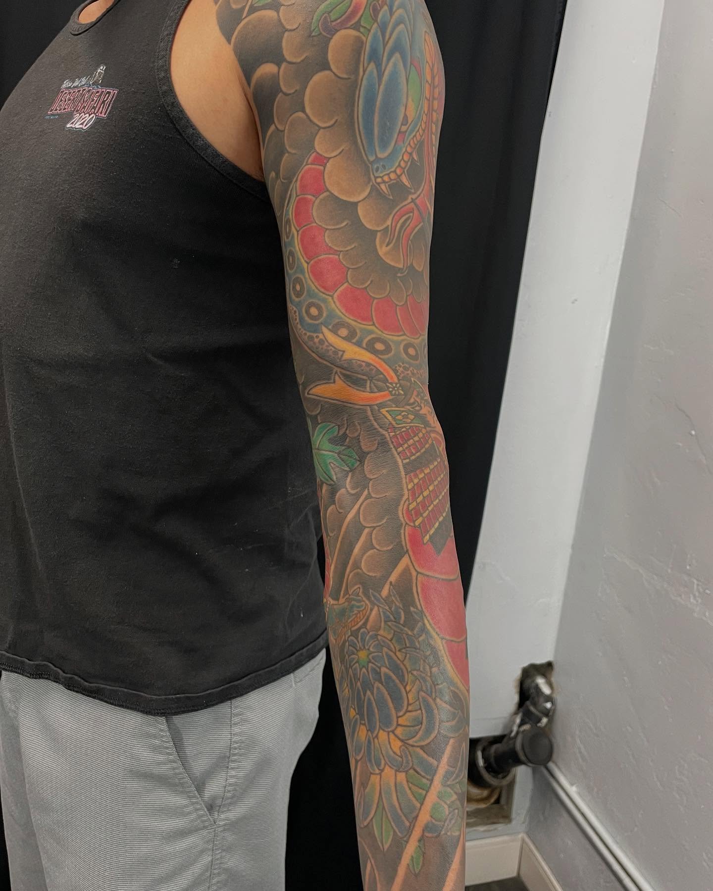 Floral dragon japanese irezumi tattoo on the upper arm by Ei Horimiya Omiya