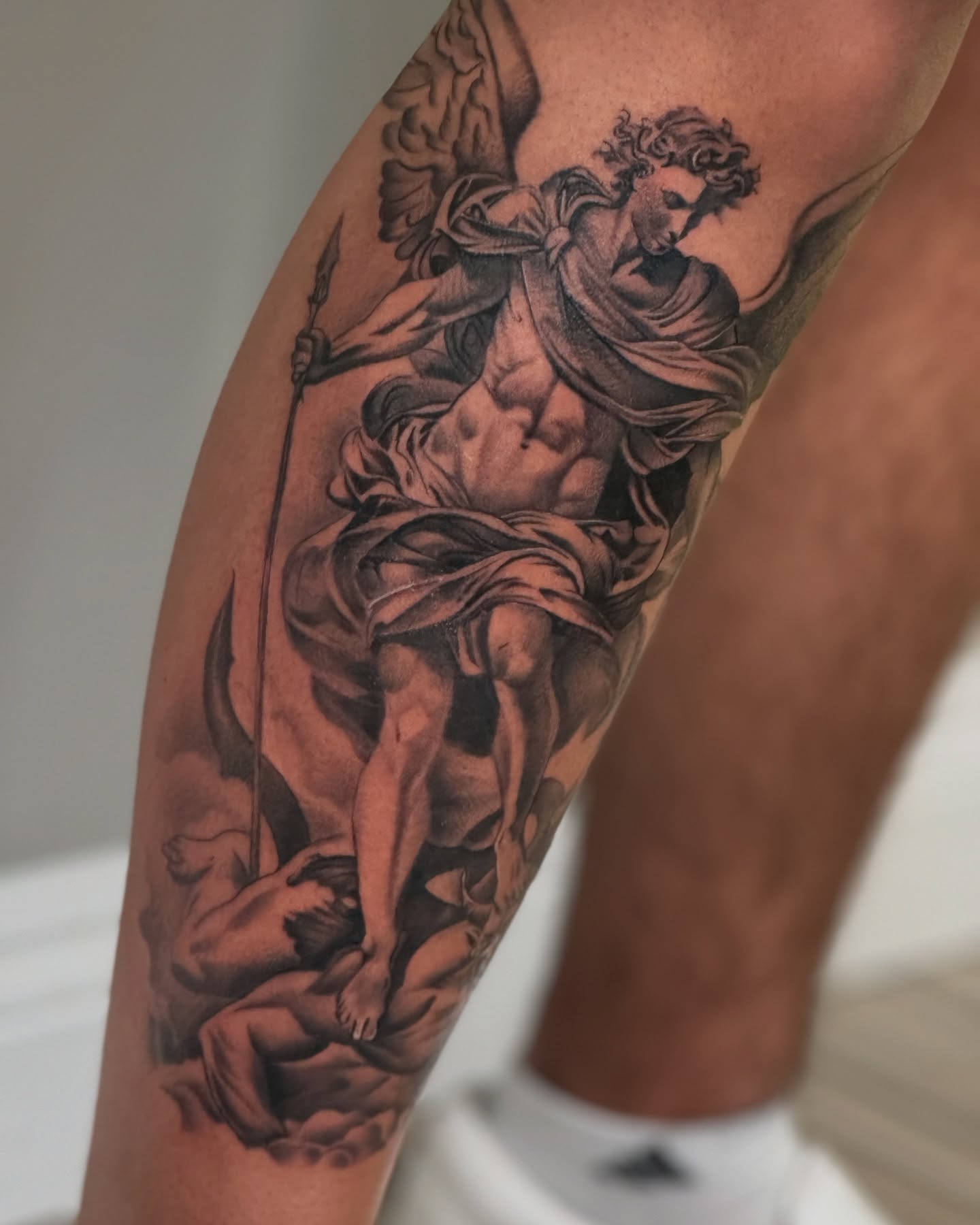Angel with spear realism tattoo on the calf by Angel Pineda-Rodriguez