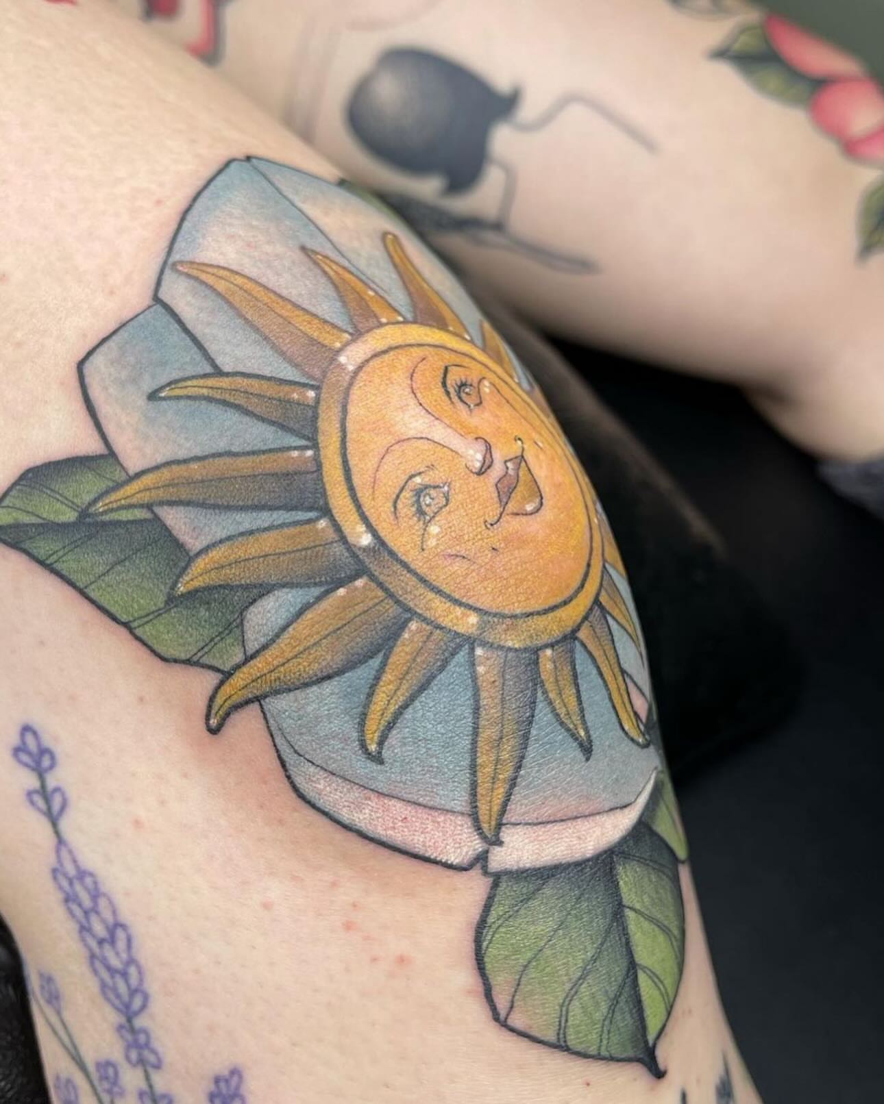 Sun American traditional tattoo on the upper arm by Noel Martinez, Golden, Colorado