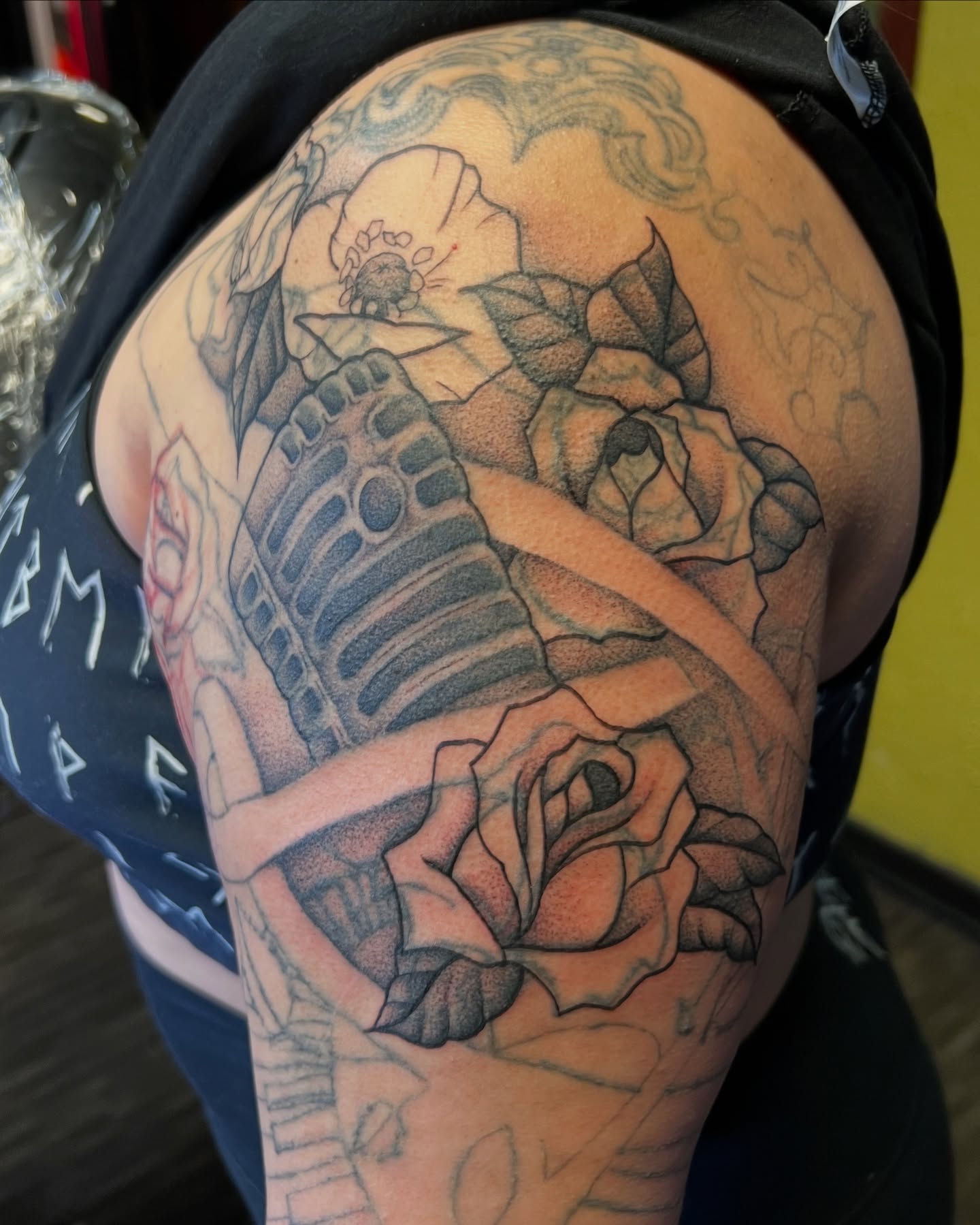 Rose and ribcage realism tattoo on the shoulder by Dani McBay
