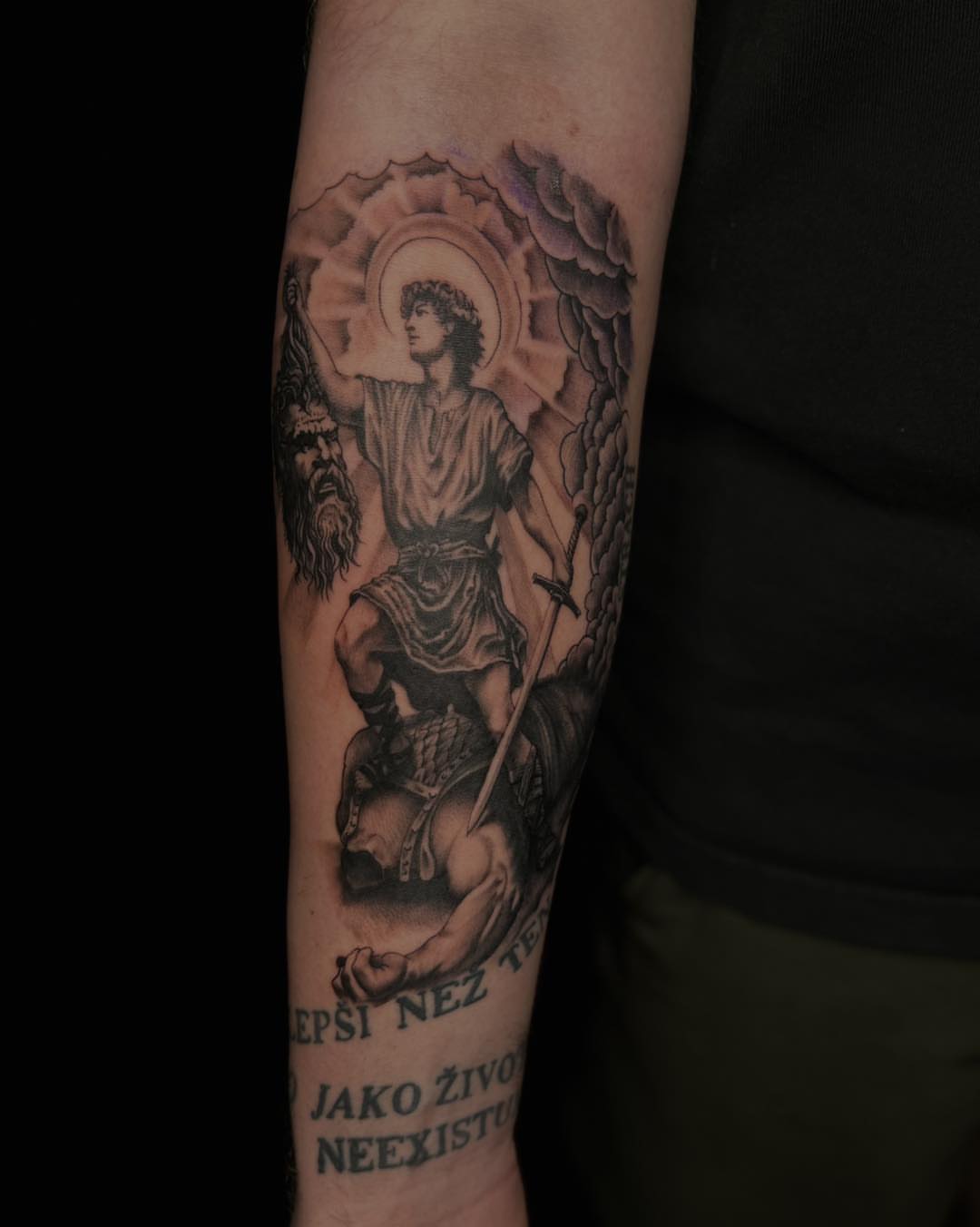 Religious figure realism tattoo on the forearm by James Reed Tattoo artist