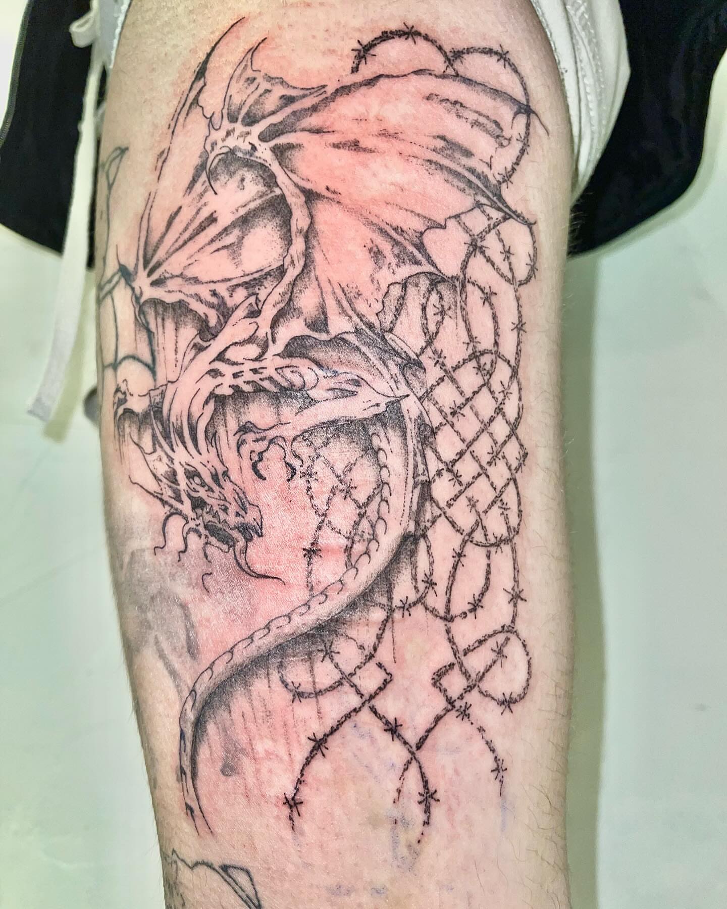 Dragon dark realism tattoo on the forearm by @initiationoftorture