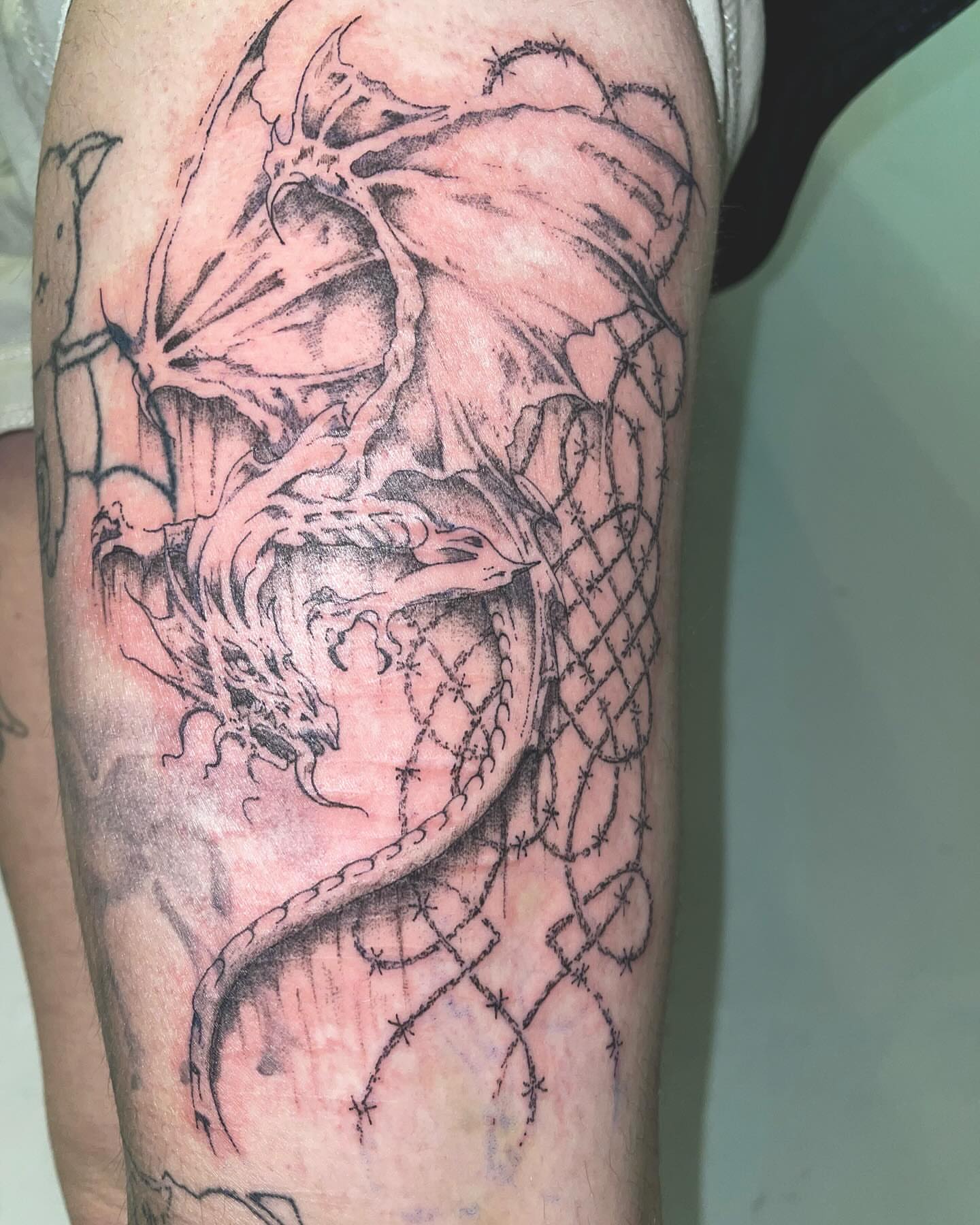 Dragon black and grey tattoo on the forearm by @initiationoftorture