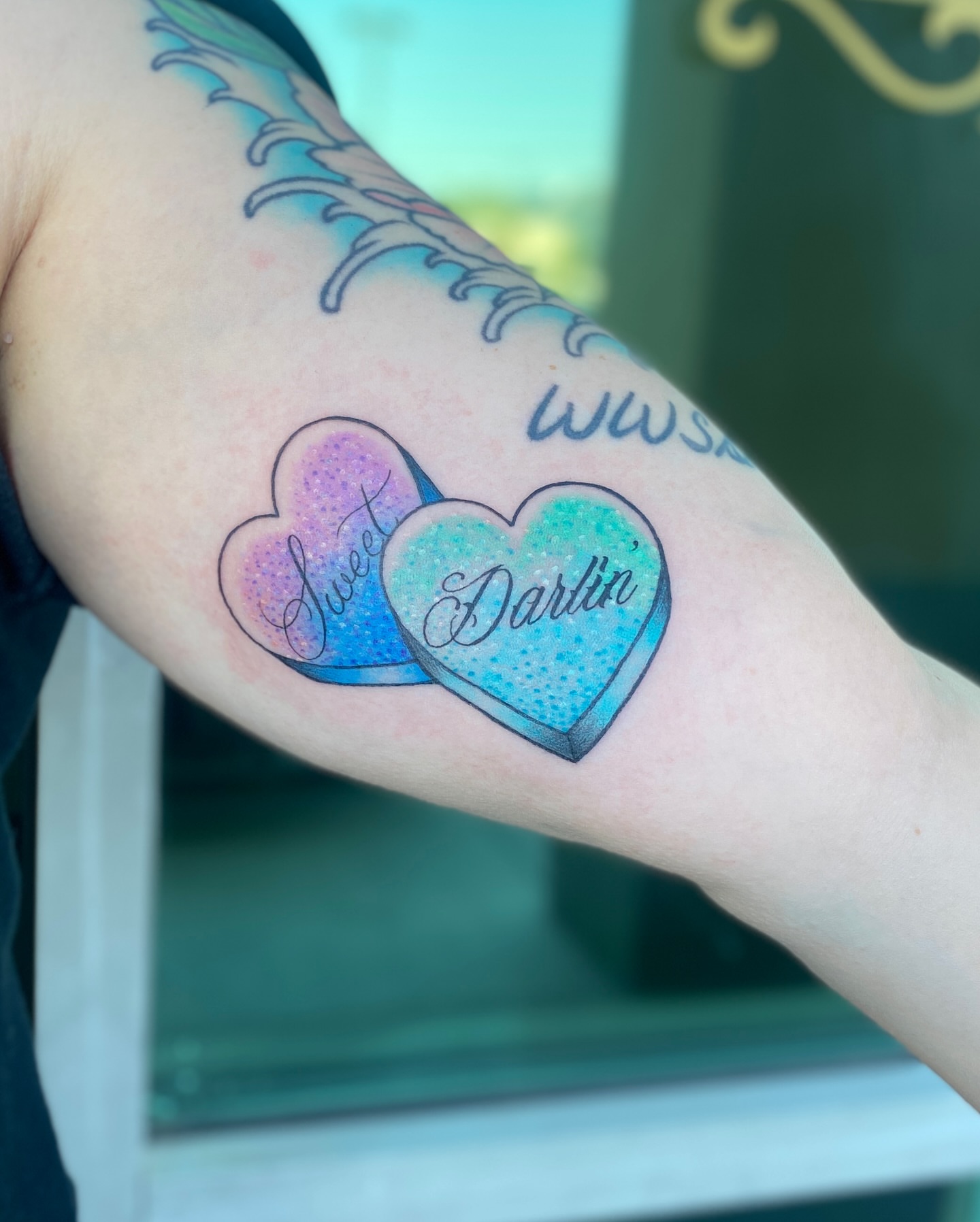 Hearts dotwork tattoo on the forearm by Elliot Jaye Valentine