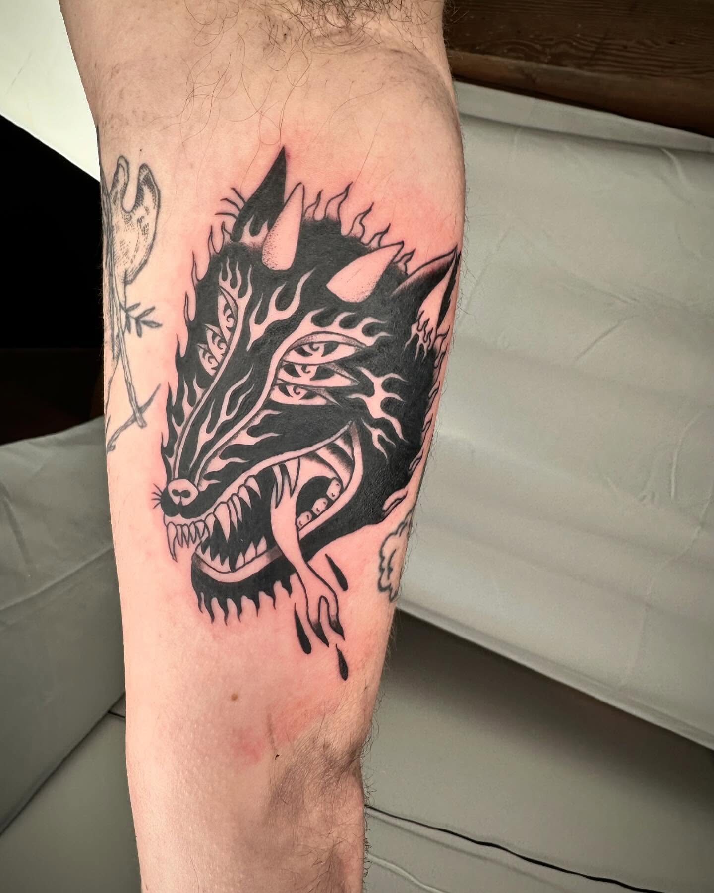 Wolf black and grey tattoo on the forearm by rory