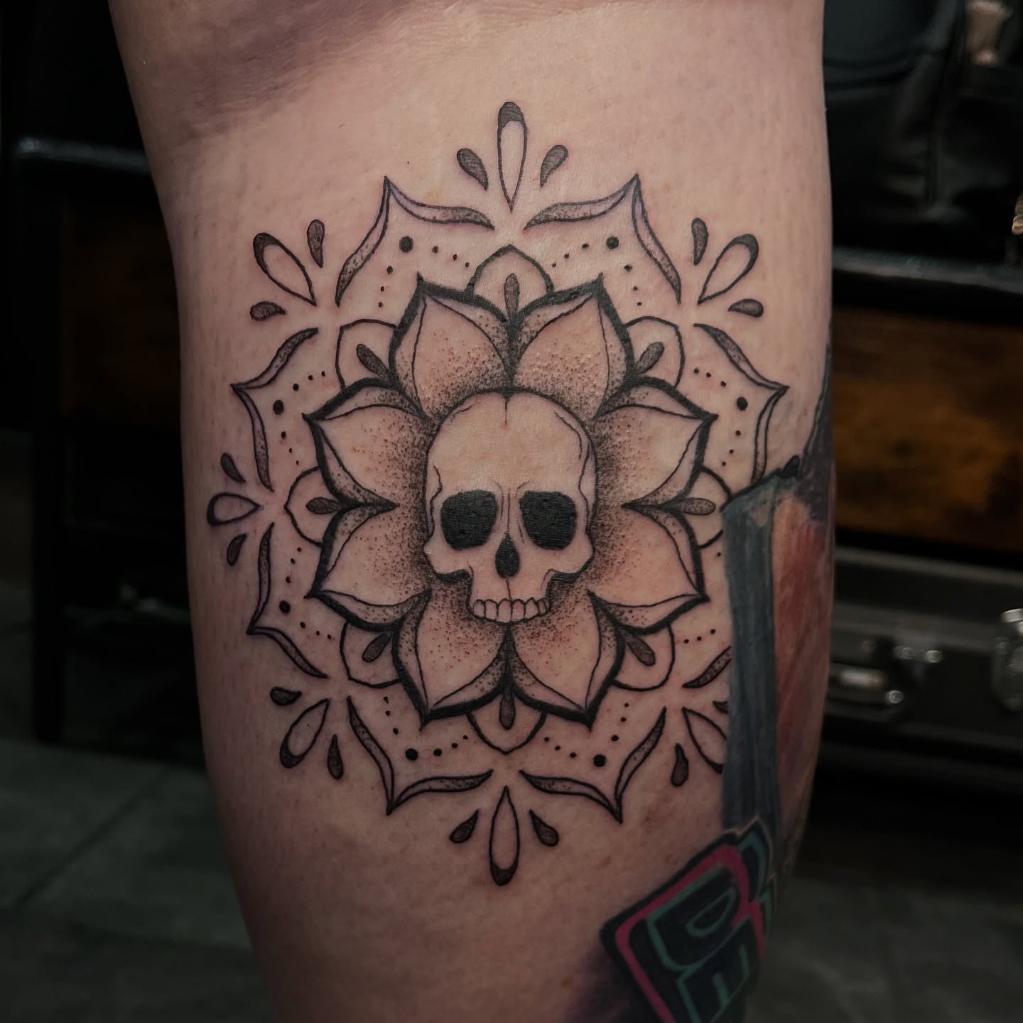 Skull and lotus dotwork tattoo on the thigh by Tina Petrullo, West Chester Township, Butler County, Ohio
