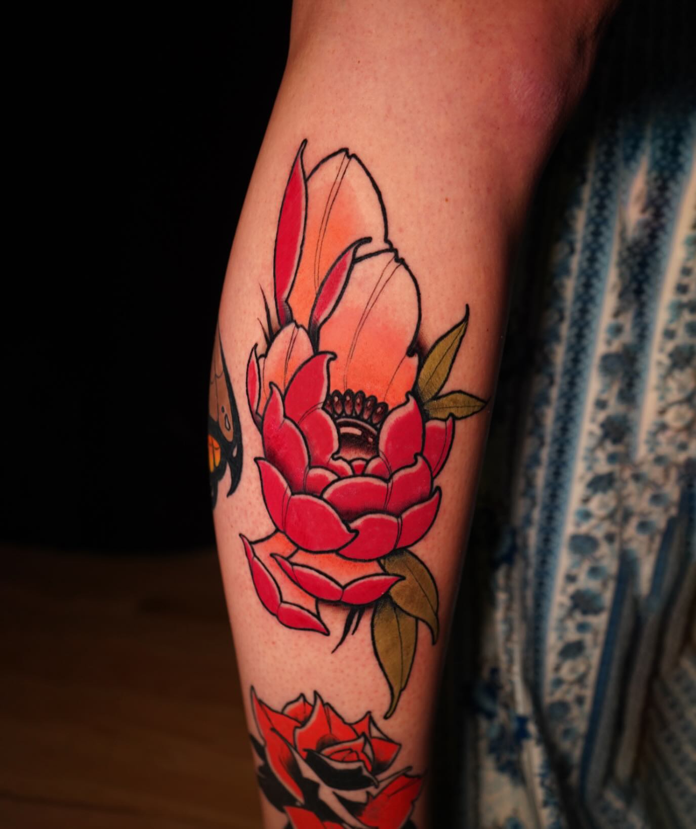 Red rose American traditional tattoo on the forearm by Alex Larsen
