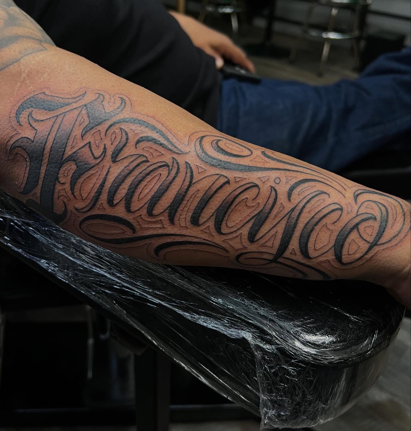 Francisco lettering script tattoo on the forearm by Niz Carrillo