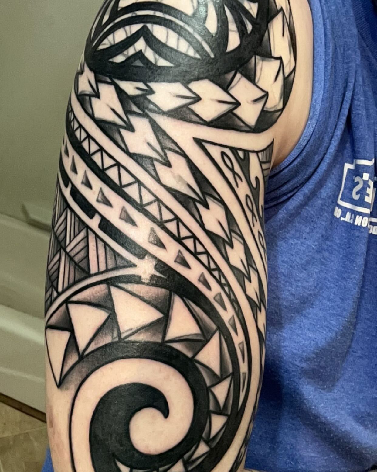 Tribal pattern tribal tattoo on the upper arm by Will Eagle