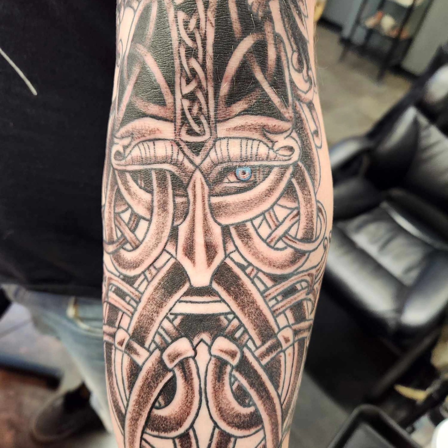 Viking helmet black and grey tattoo on the forearm by Samantha Von Zombia, Saint Paul, Minnesota