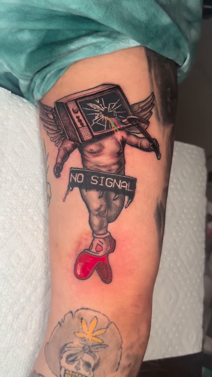 Cherub with TV head dark realism tattoo by Adrian Dominguez, Las Vegas, Nevada