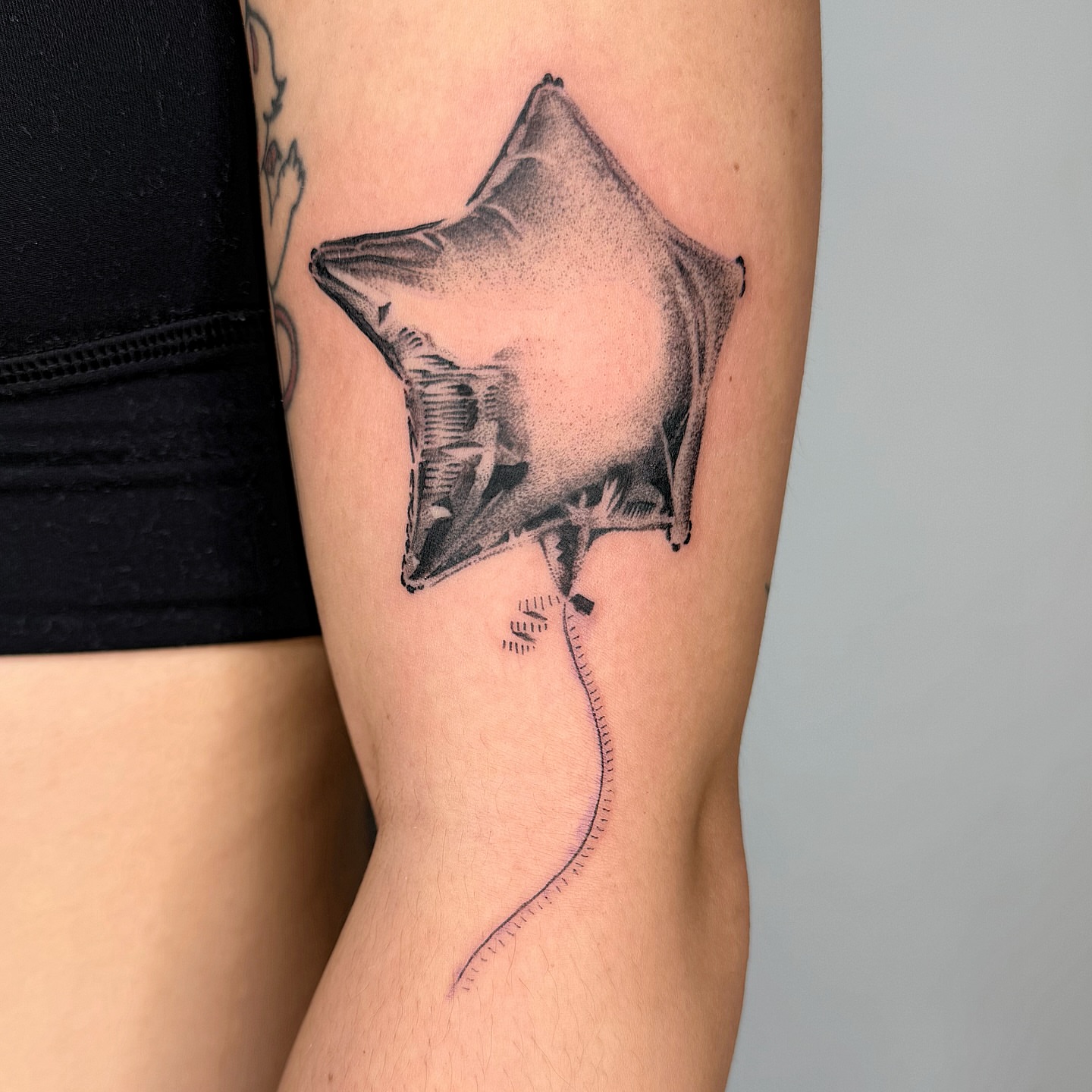 Ray dotwork tattoo on the forearm by Jenni Palomaa