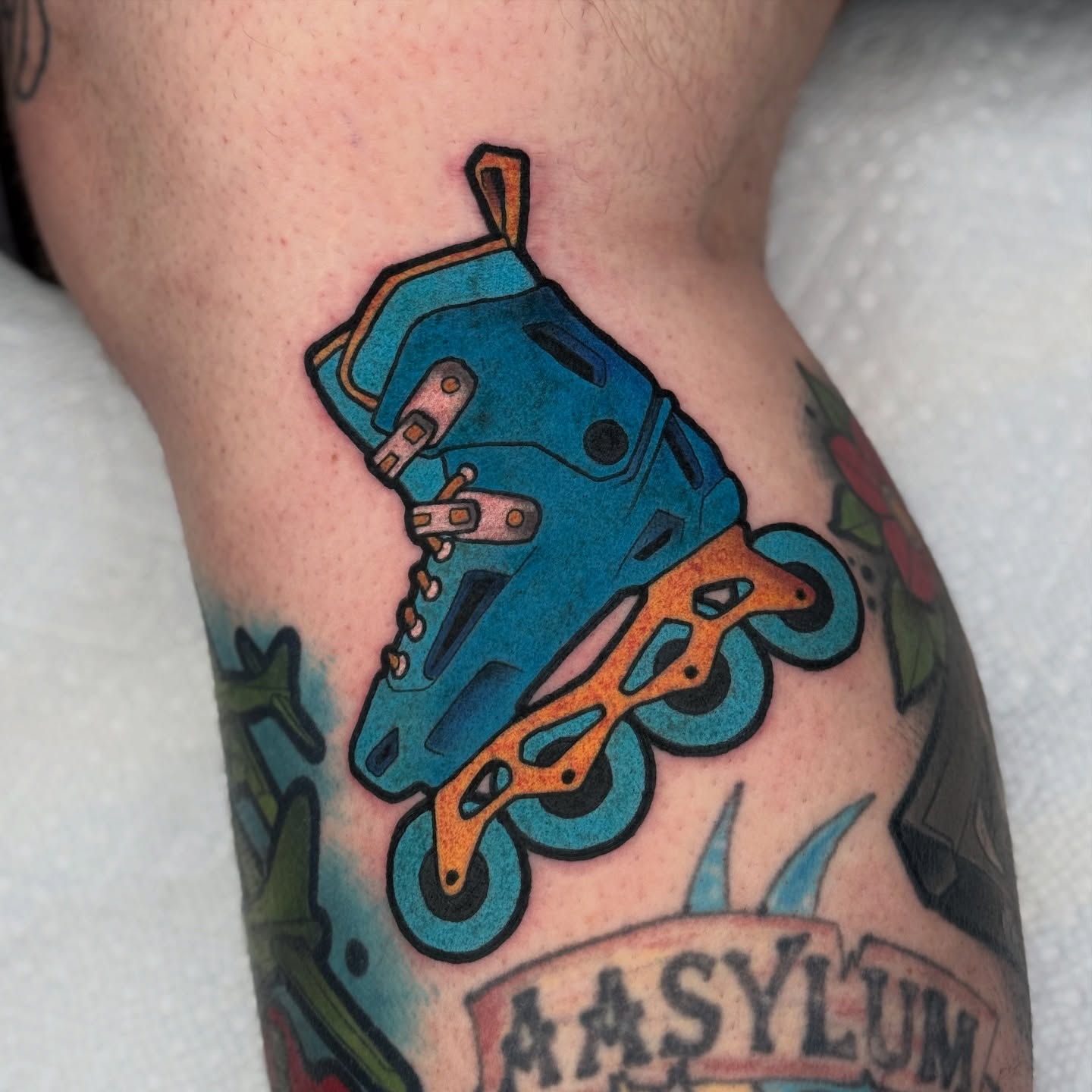 Roller skate American traditional tattoo on the leg by T Dubs ✏️