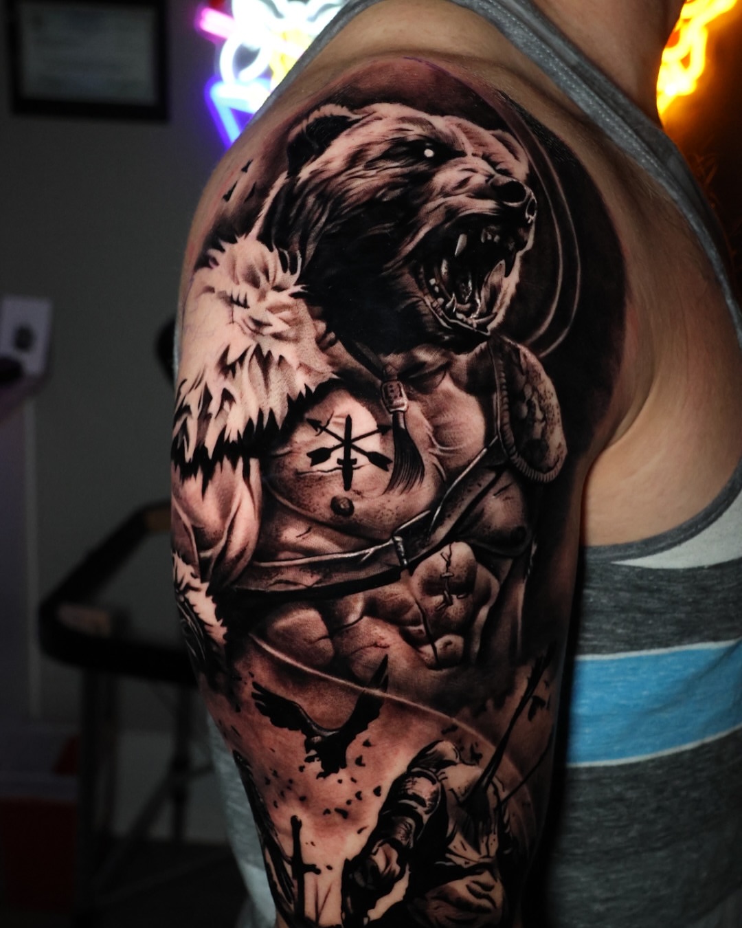 Bear and warrior realism tattoo on the shoulder by Jesus Bravo
