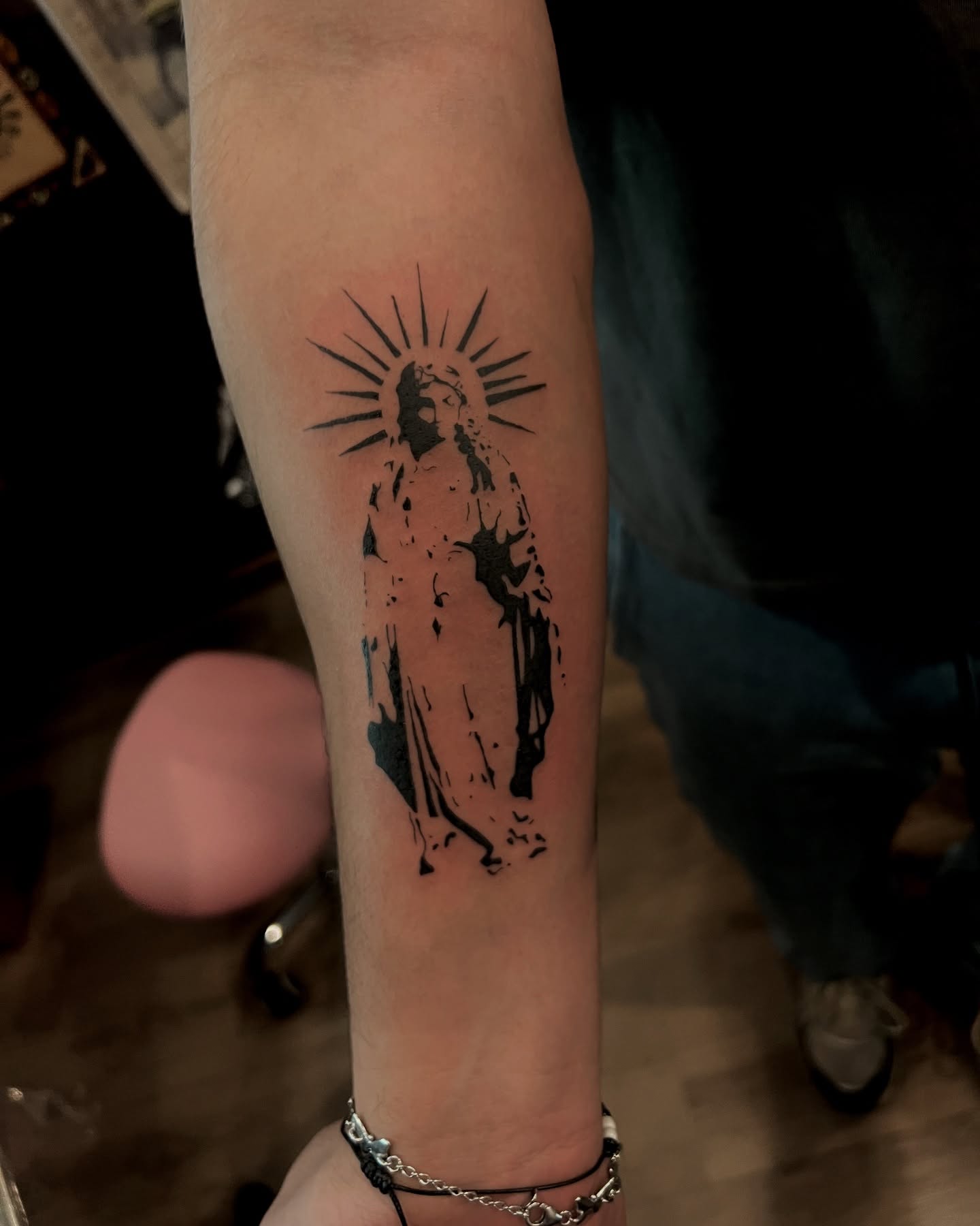 Religious figure black and grey tattoo on the forearm by crystal 🧿