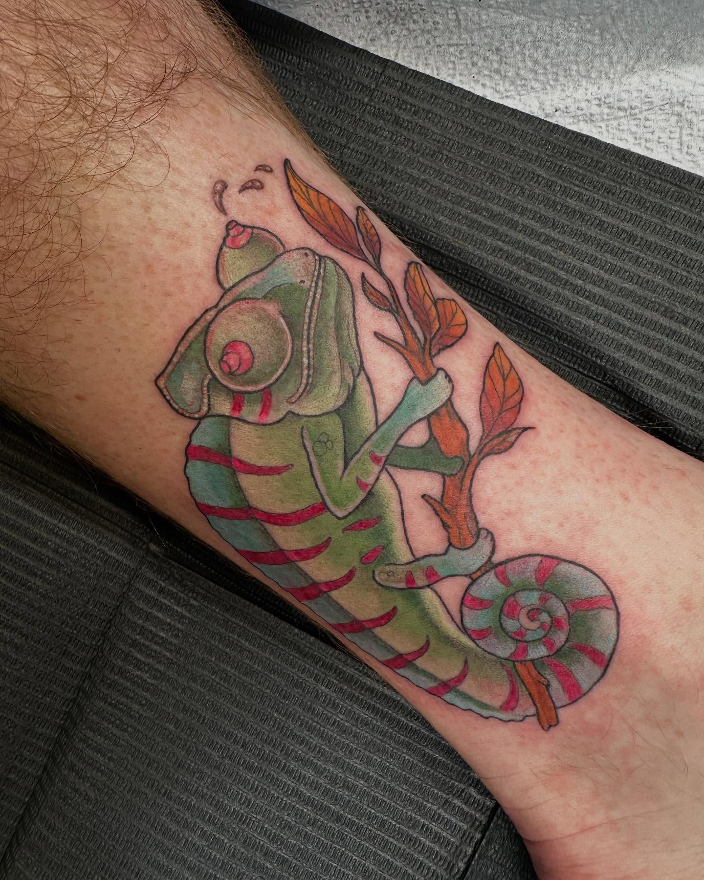 Chameleon new school tattoo on the forearm by Michele Estes