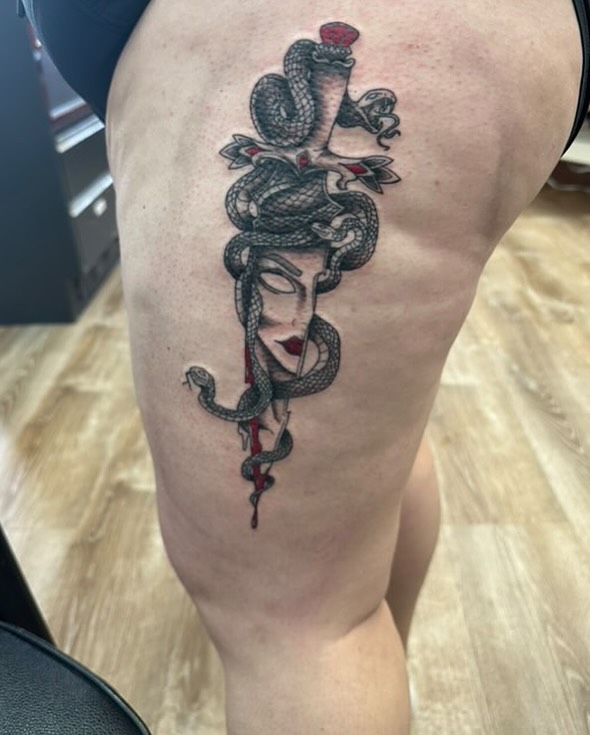 Woman with snake American traditional tattoo on the thigh by Ricardo (RJ)