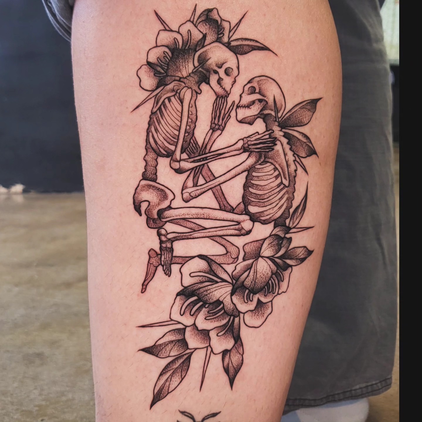 Skeletons and flowers dotwork tattoo on the thigh by Brenda Juarez - Tattoo Artist
