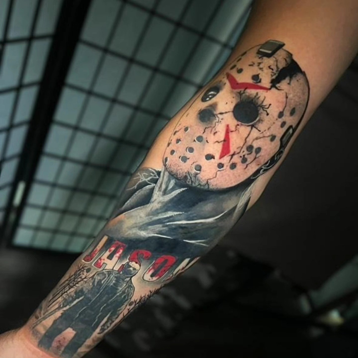 Jason voorhees mask trash polka tattoo on the forearm by Tattoo Artist