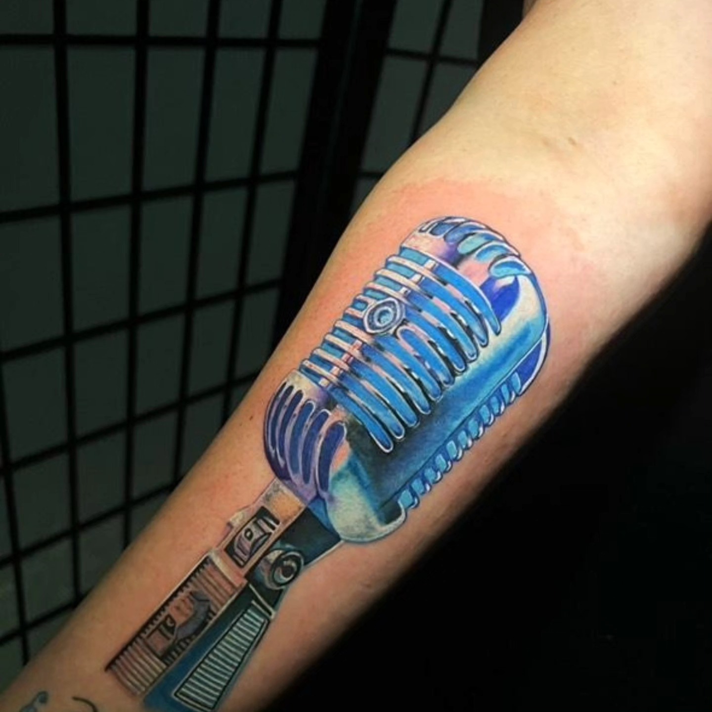 Microphone realism tattoo on the forearm by Tattoo Artist