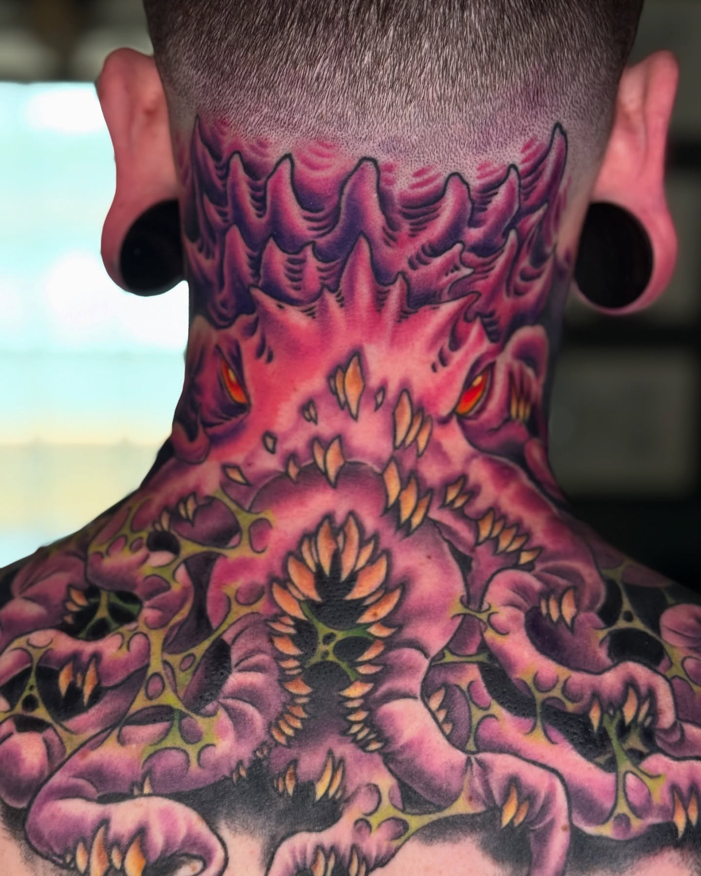 Monster American traditional tattoo on the neck by Matti Hixson