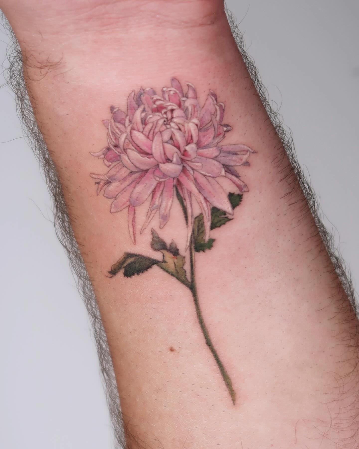 Chrysanthemum realism tattoo on the forearm by Alissa Jung