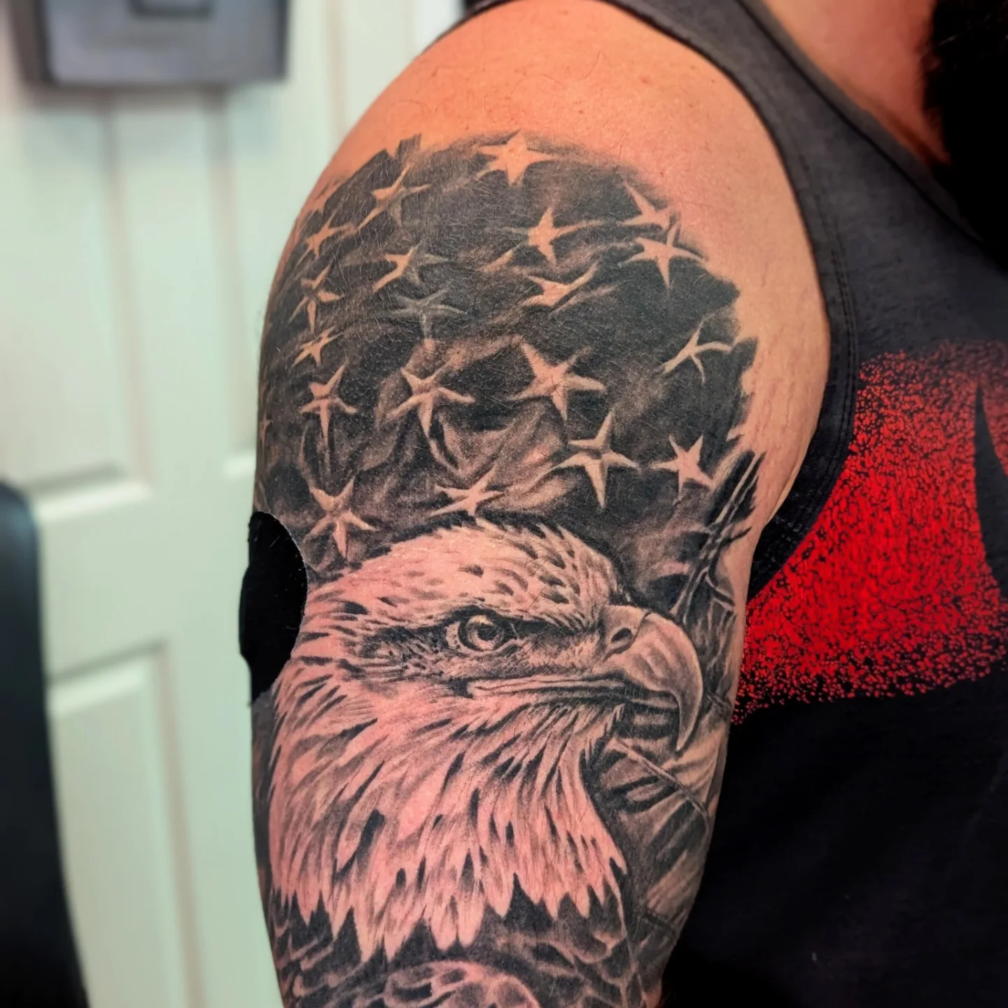 American flag and eagle realism tattoo on the shoulder by Bethany Jane Tattoos