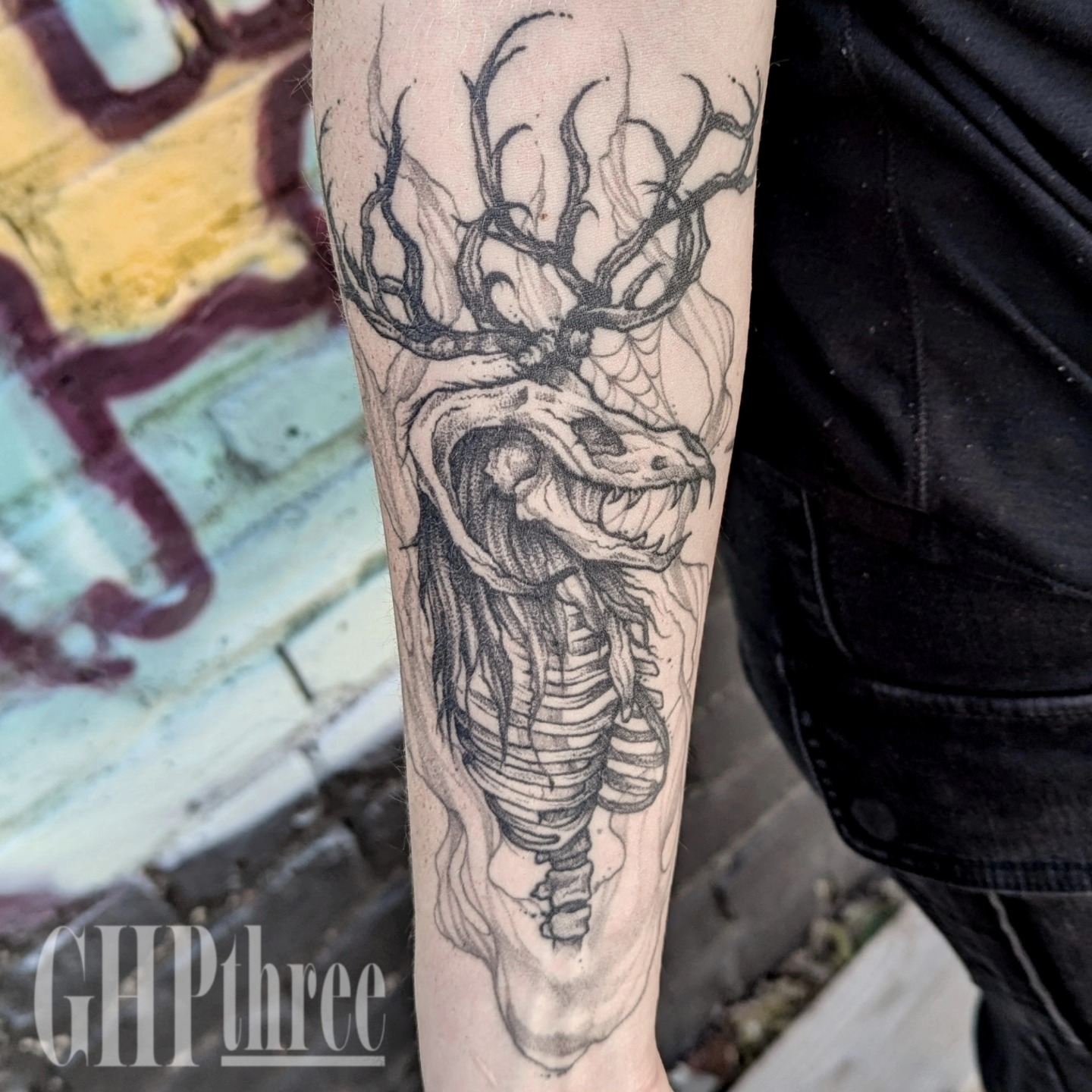 Deer skull realism tattoo on the forearm by Gail Howard Perry III