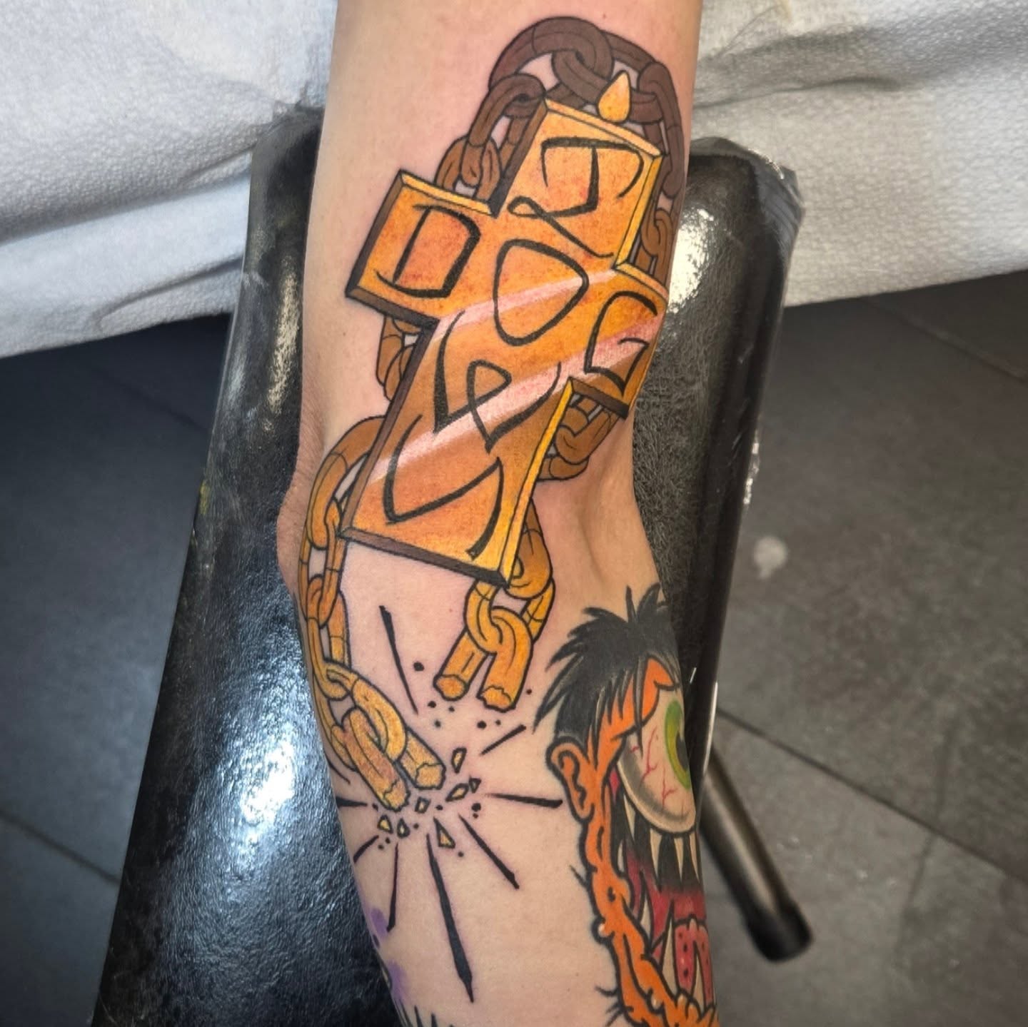 Cross and chains American traditional tattoo on the forearm by Brian Savage, Gilbert, Arizona