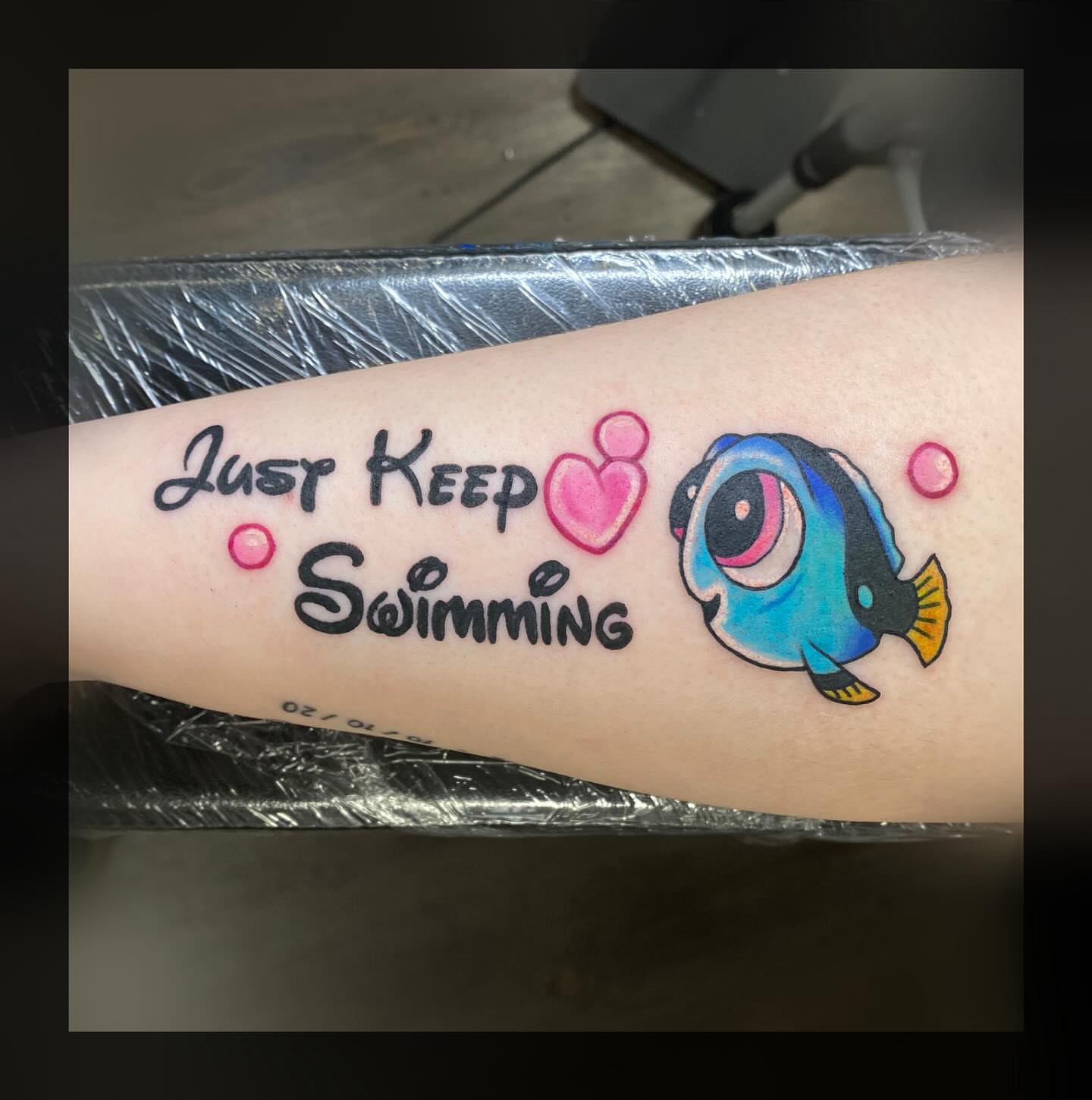 Just Keep Swimming dotwork tattoo on the forearm by Romans