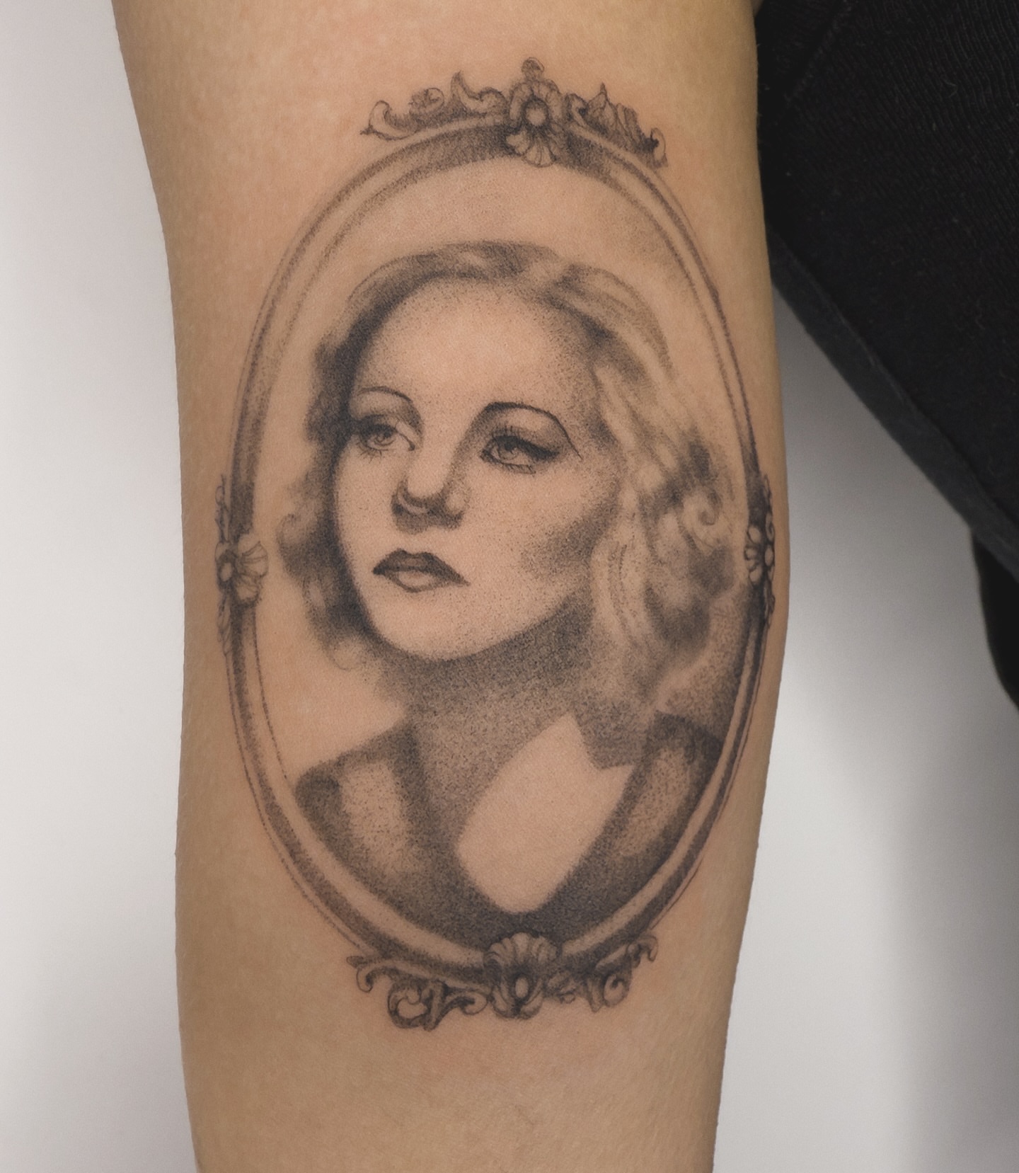 Portrait realism tattoo on the forearm by Blackwork & microrealism tattoos