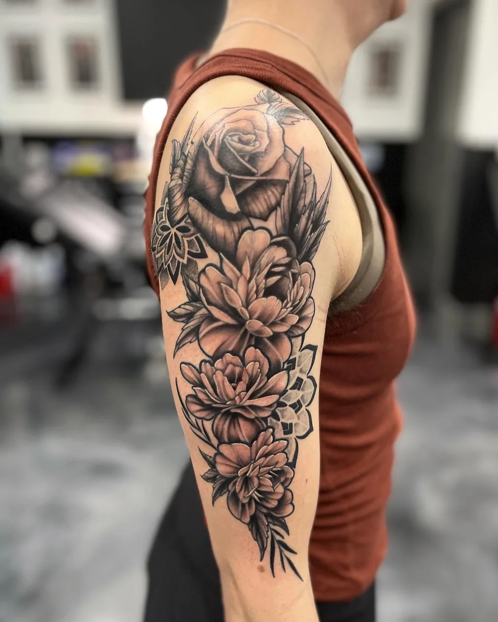 Floral bouquet black and grey tattoo on the forearm by Adam Silfies