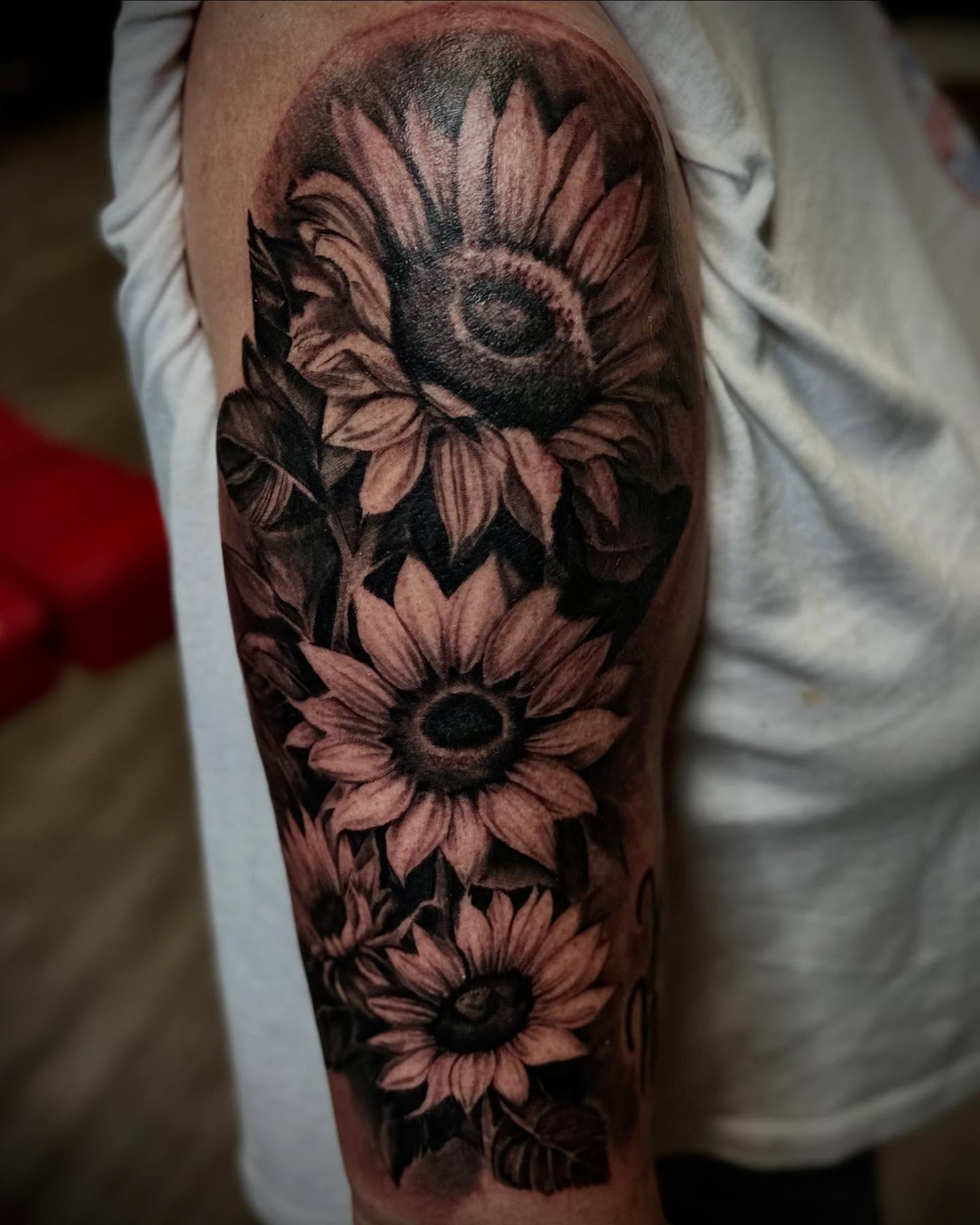 Sunflowers realism tattoo on the forearm by Tattoo Artist Ian Day (Everlasting_Art_Ink)