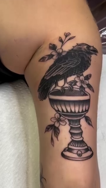 Raven on a pedestal realism tattoo by Nick Ochoa