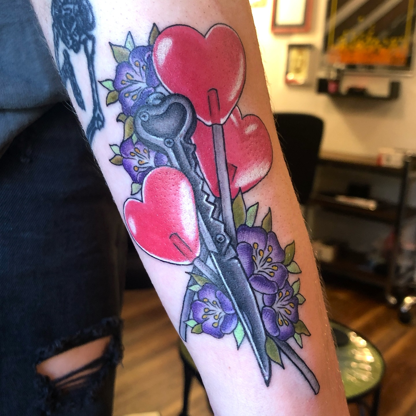 Scissors and hearts American traditional tattoo on the forearm by Krystal ✨